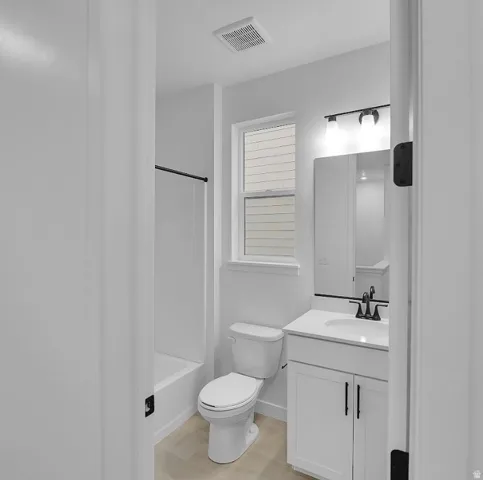 Bathroom featuring vanity and shower / bath combination