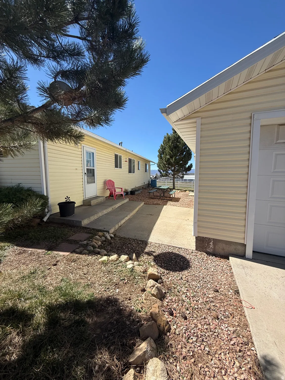 View of yard featuring a patio area and a garage