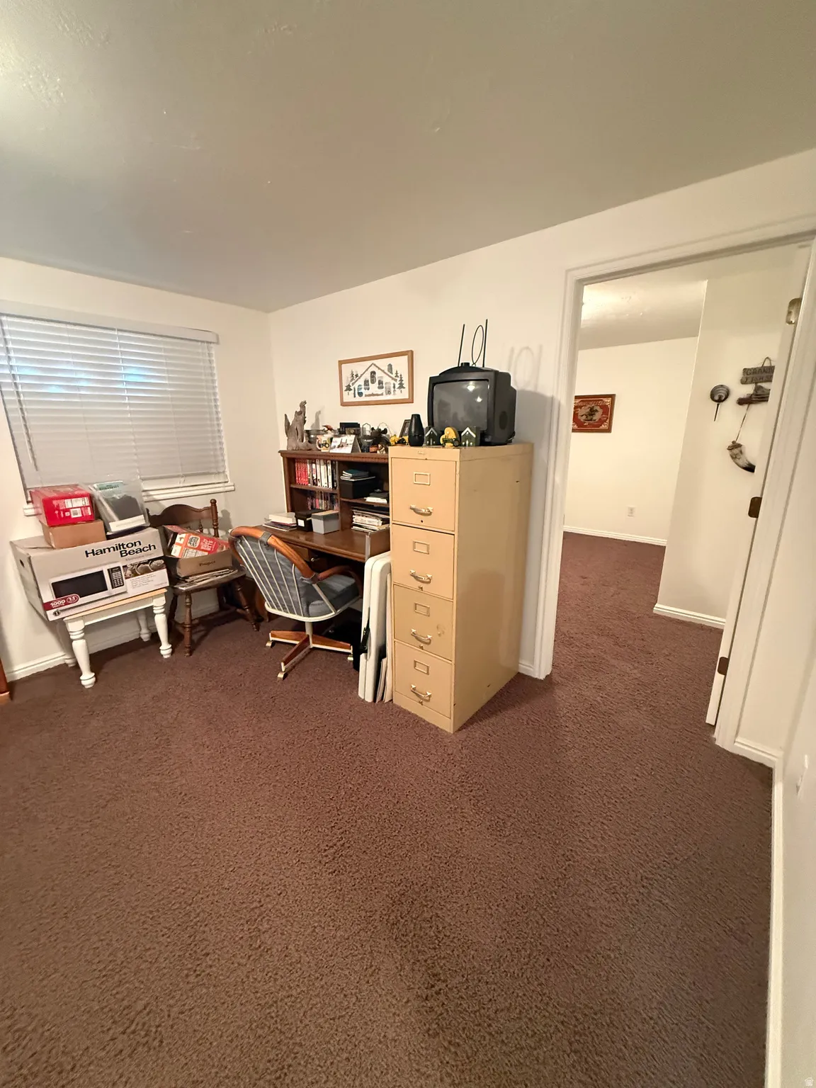 Office area with dark carpet