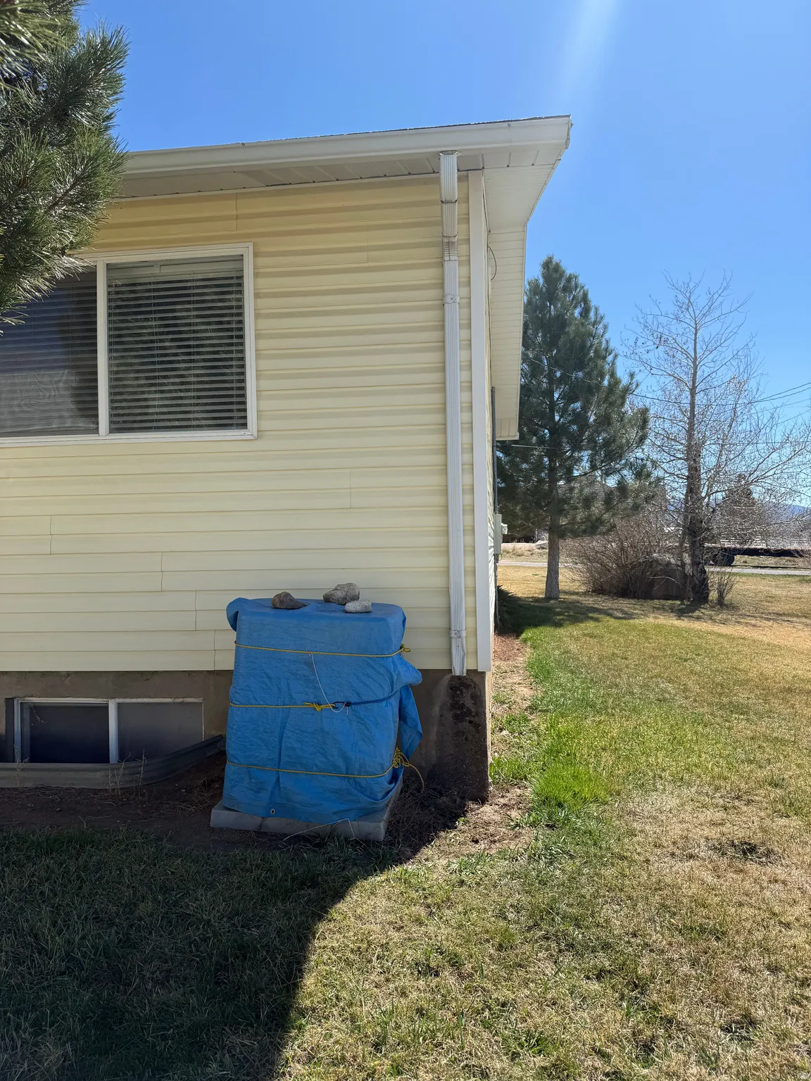 View of home's exterior with a lawn