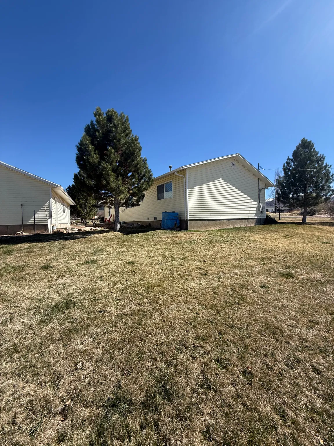 Rear view of property featuring a yard