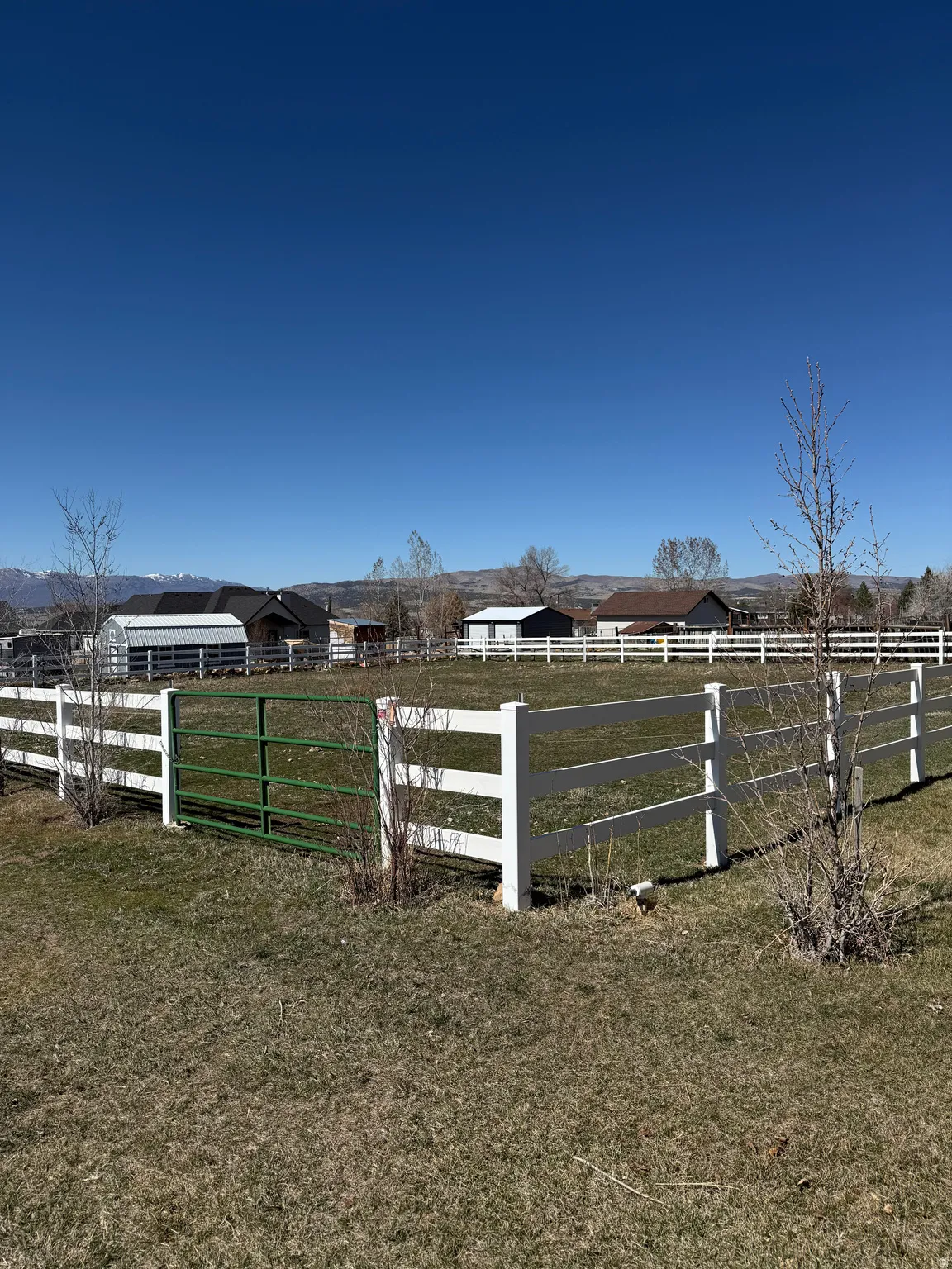 Gate with a rural view and an outdoor riding arena