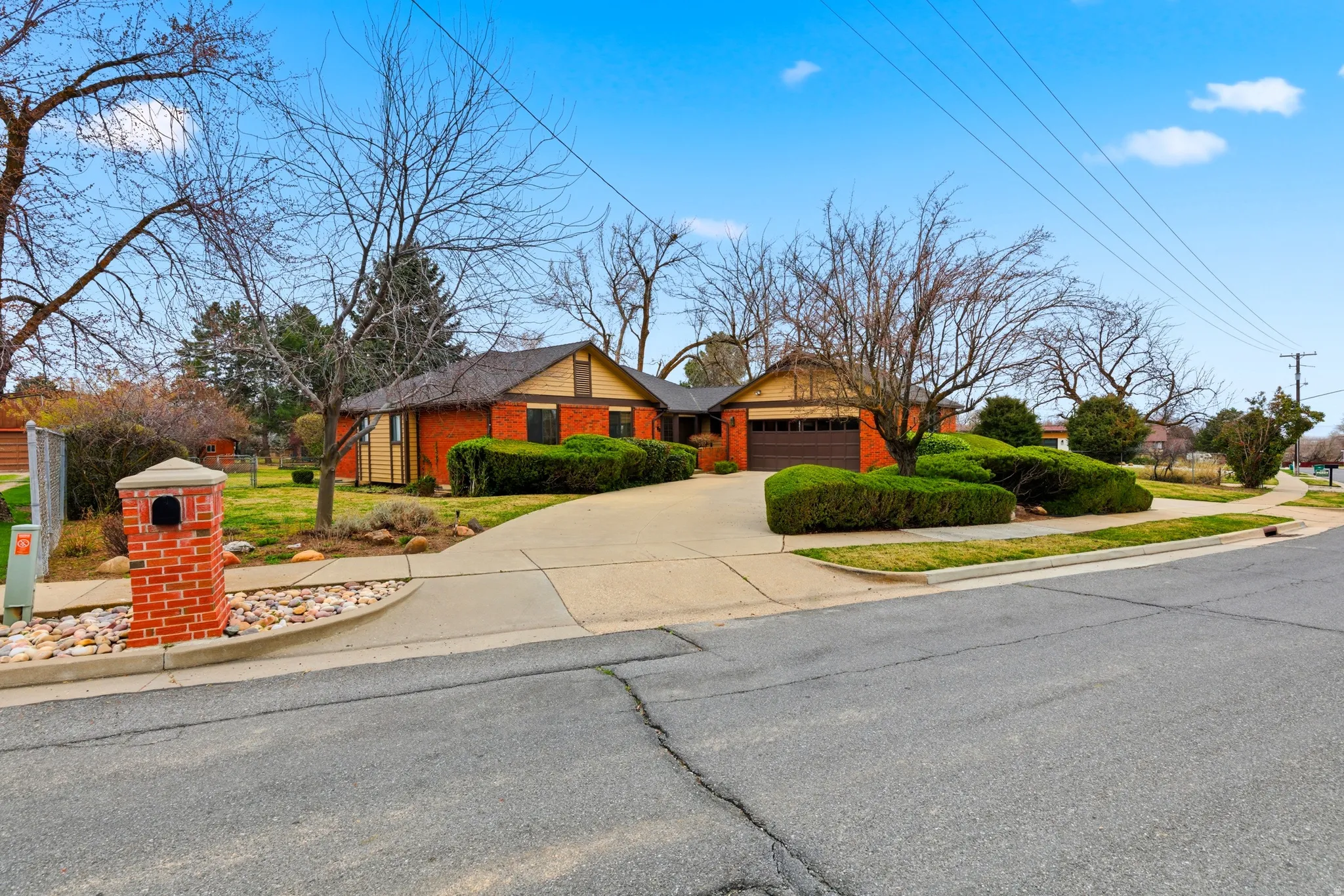 Ranch-style house with driveway and a garage