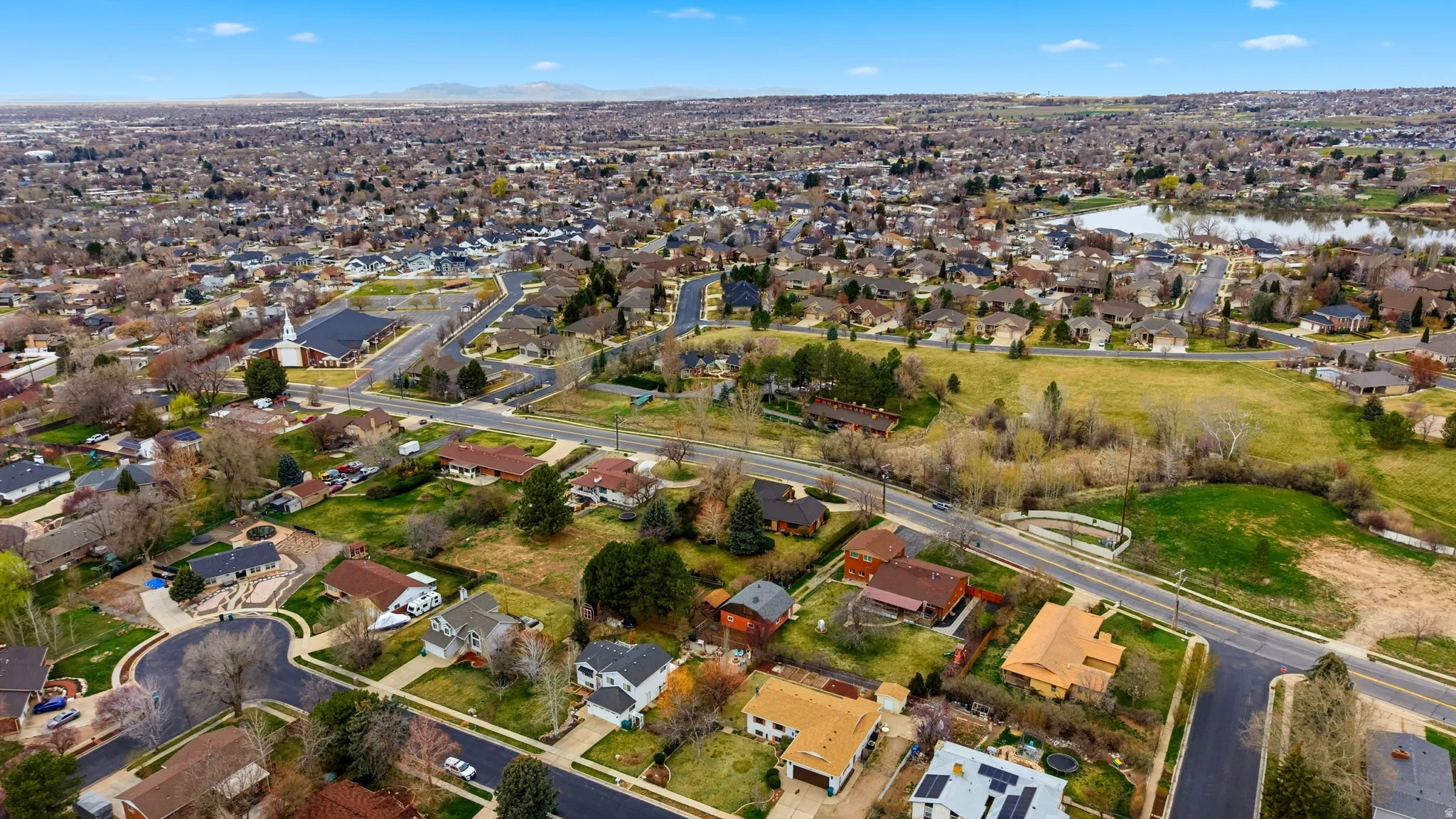 View of property location with nearby suburban area and a nearby body of water