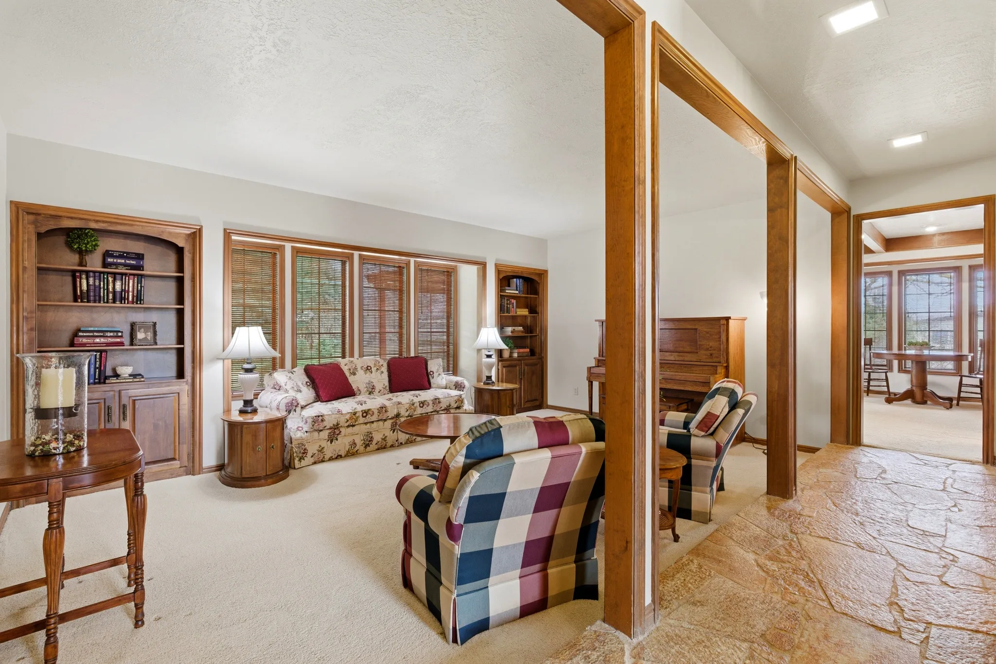 Living area featuring built in features and a textured ceiling