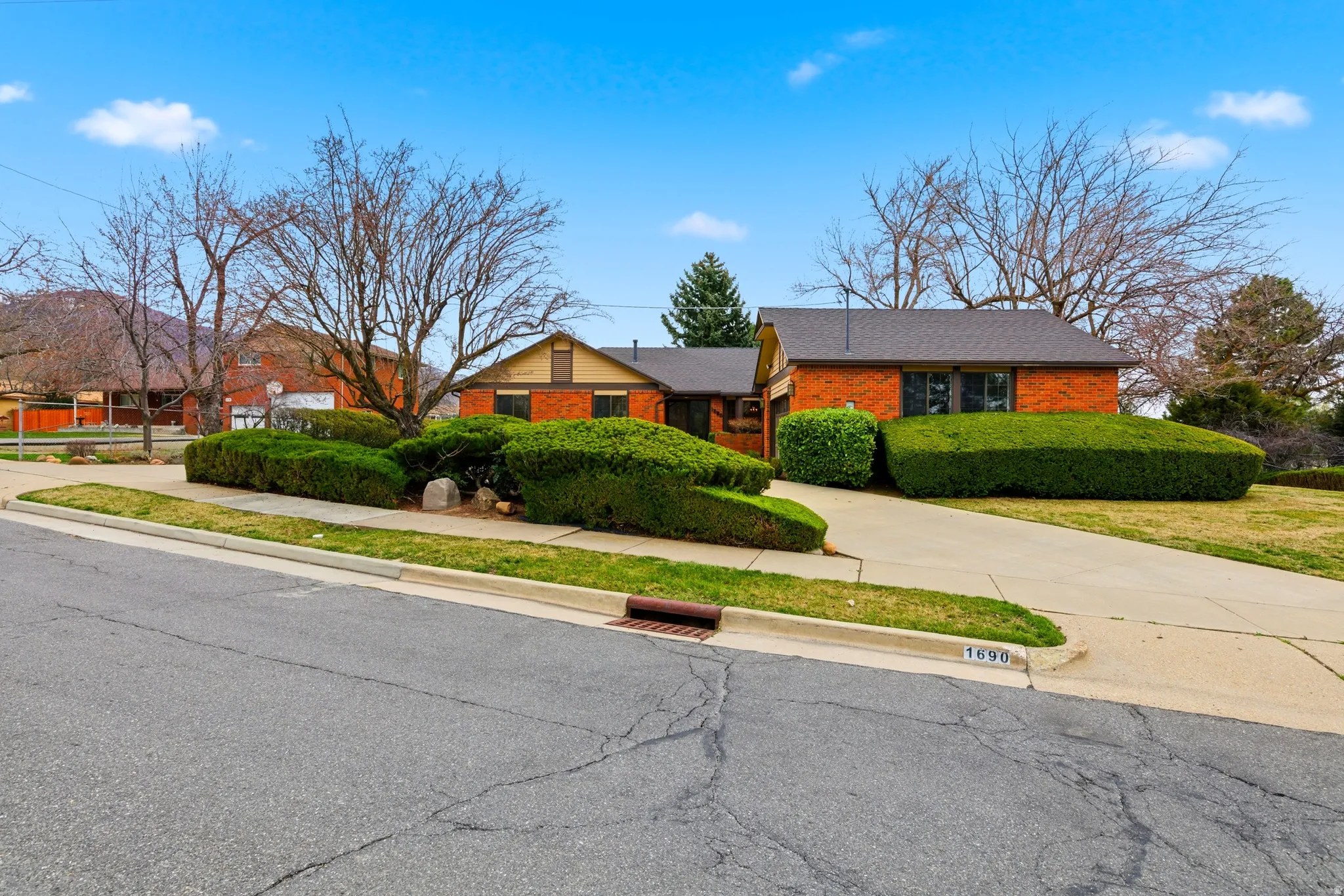 View of front of home featuring brick siding