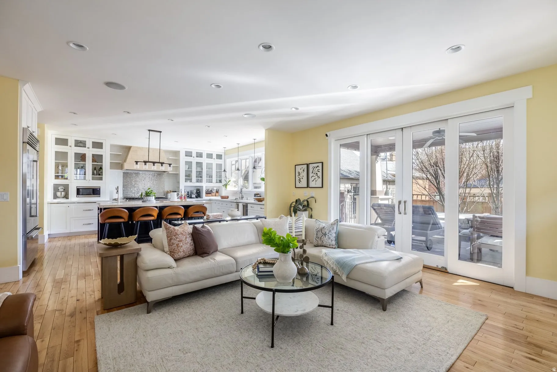 Living room featuring light wood finished floors and recessed lighting