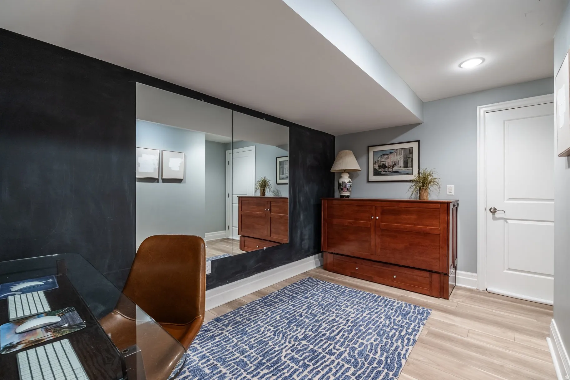 Office featuring light wood-type flooring and baseboards