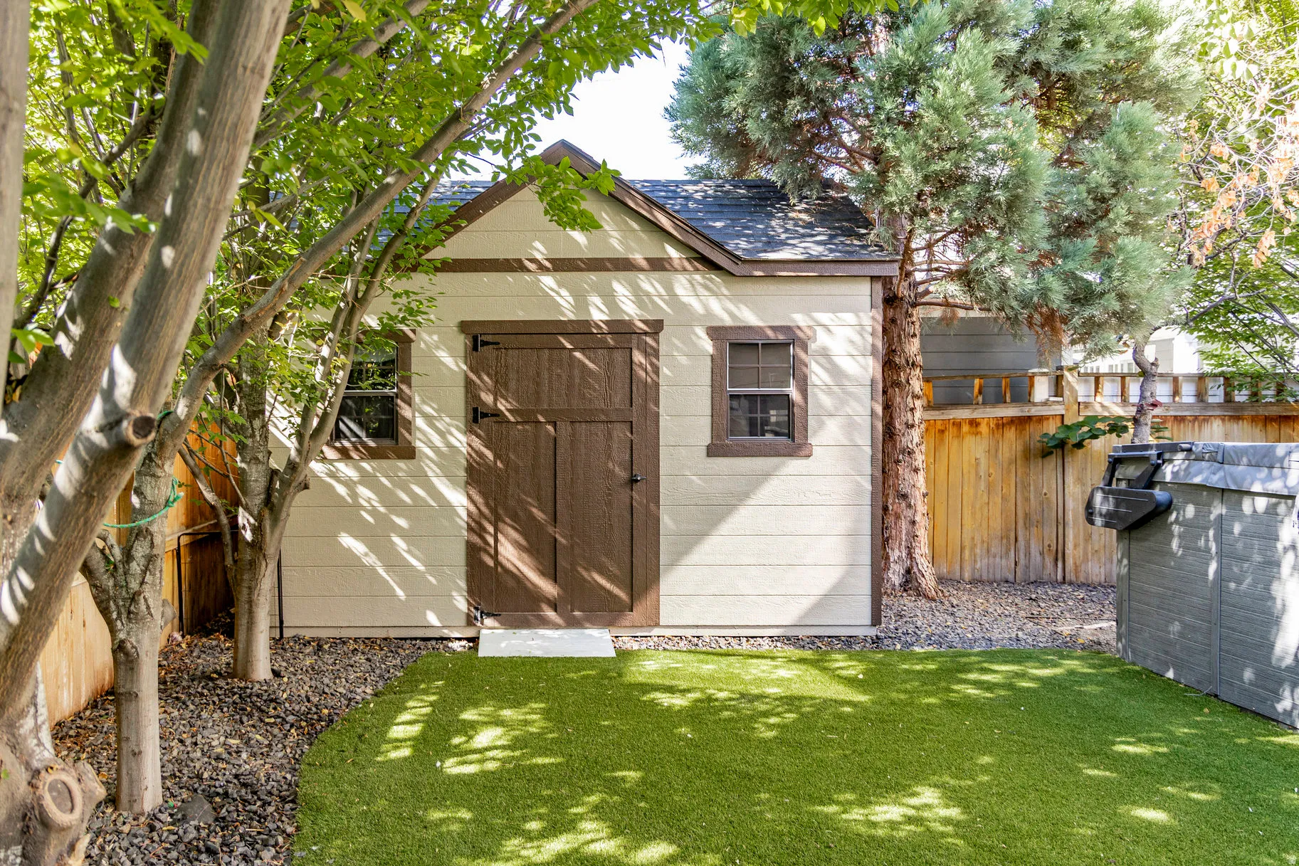 View of shed with a fenced backyard