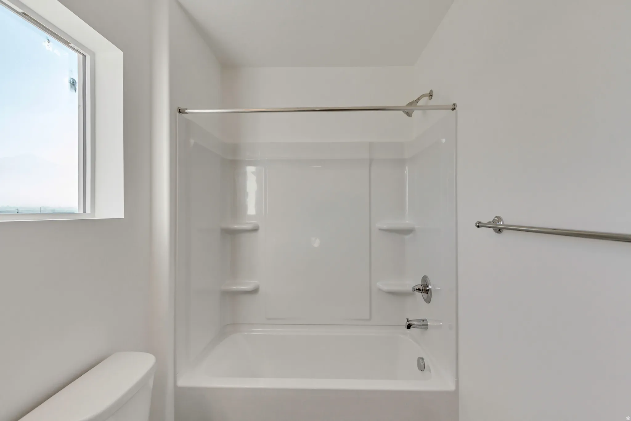 Full bath with toilet and bathtub / shower combination