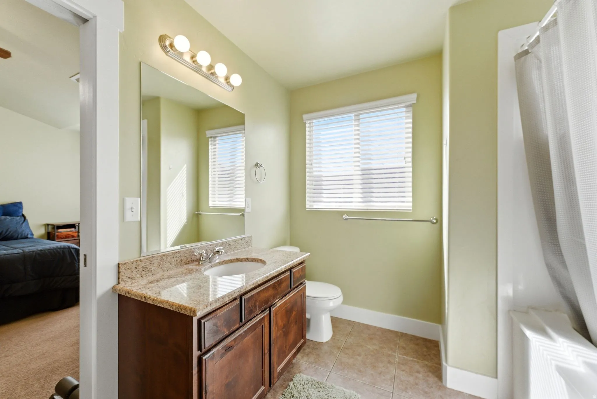 En suite bathroom featuring one of two vanities