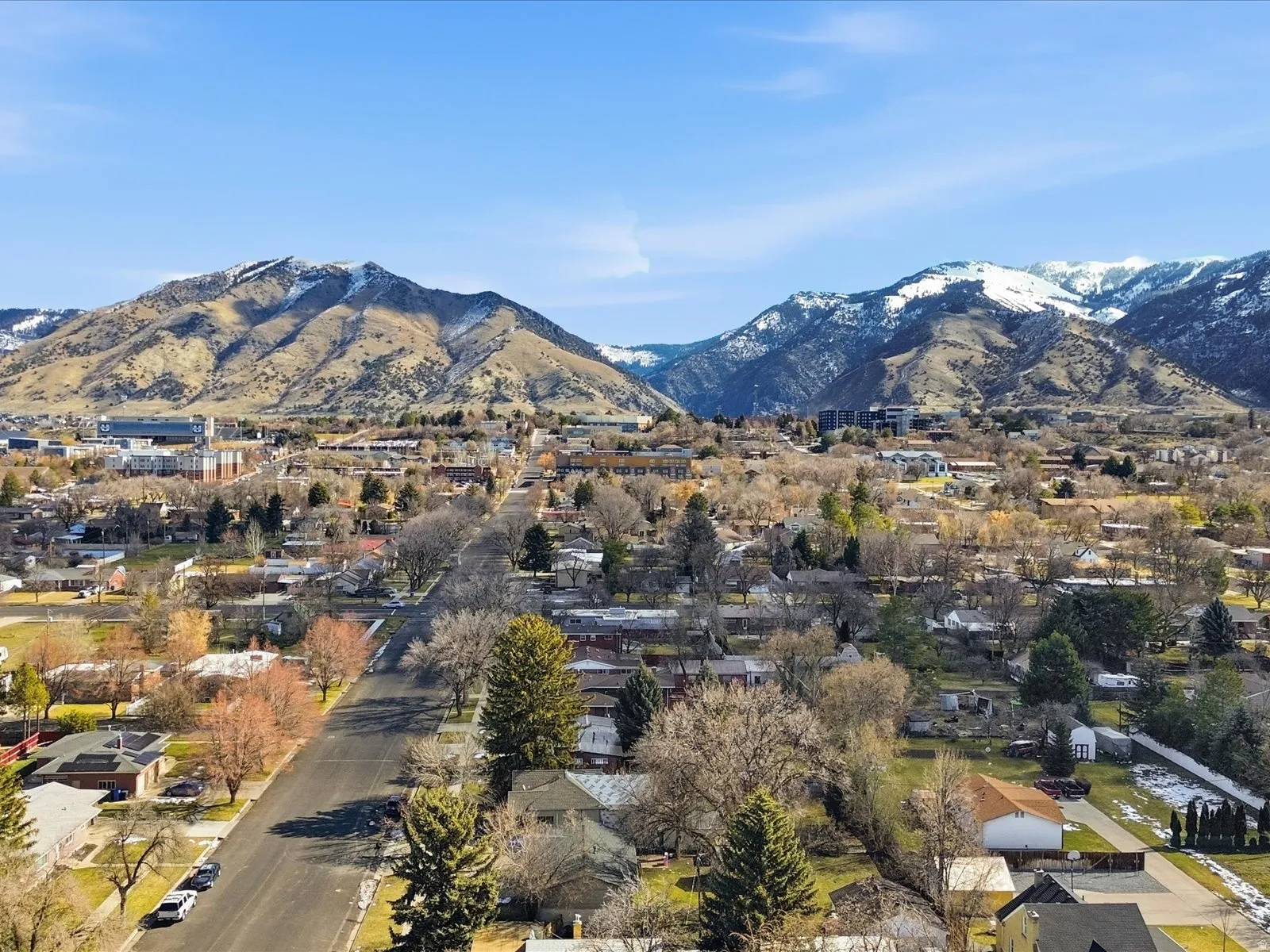 View of mountain background featuring nearby suburban area