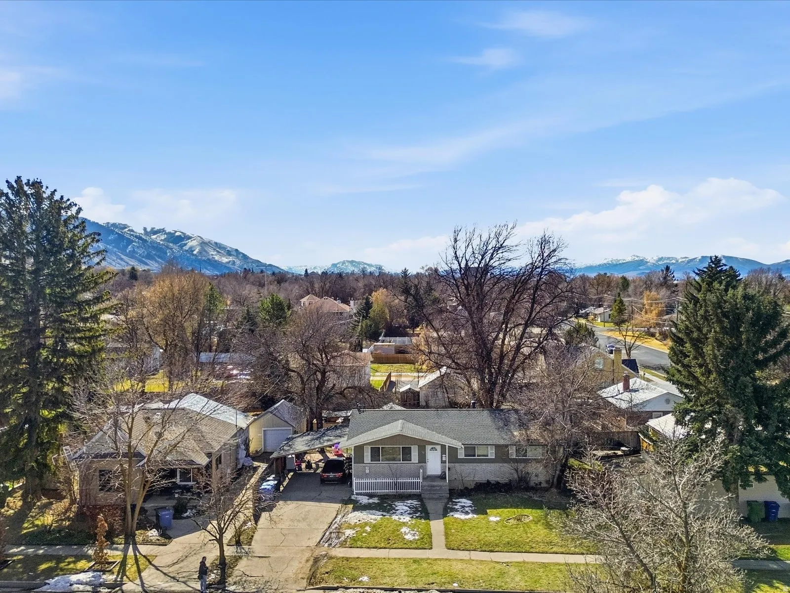 Aerial view of residential area featuring a mountain backdrop