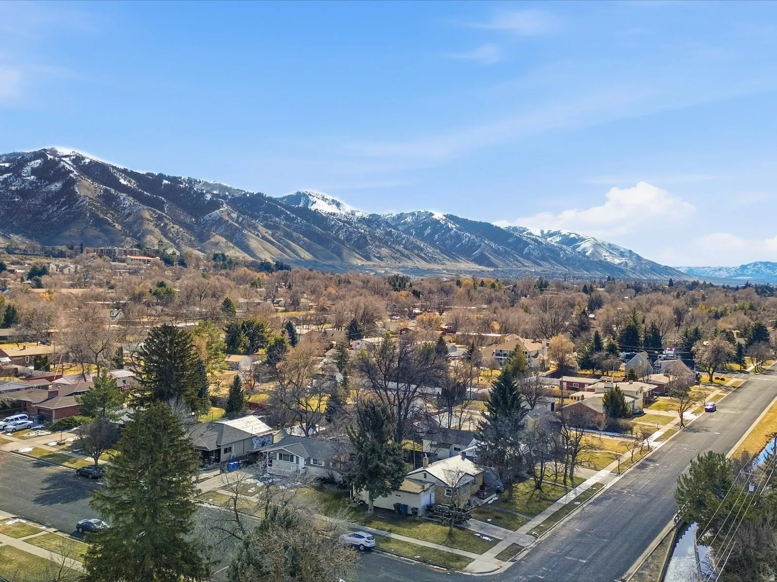 View of mountain background featuring nearby suburban area