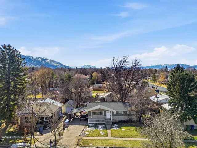 Aerial view of residential area featuring a mountain backdrop