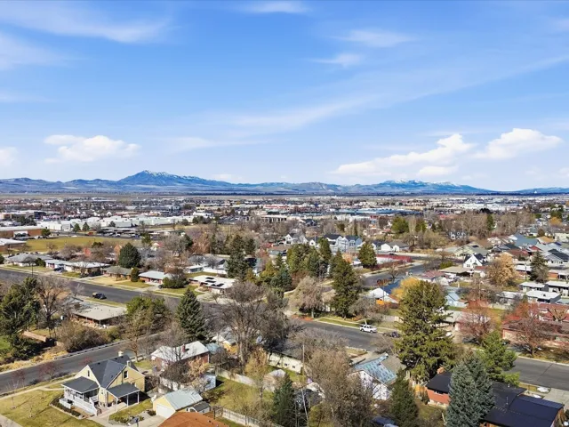 Aerial perspective of suburban area featuring a mountainous background