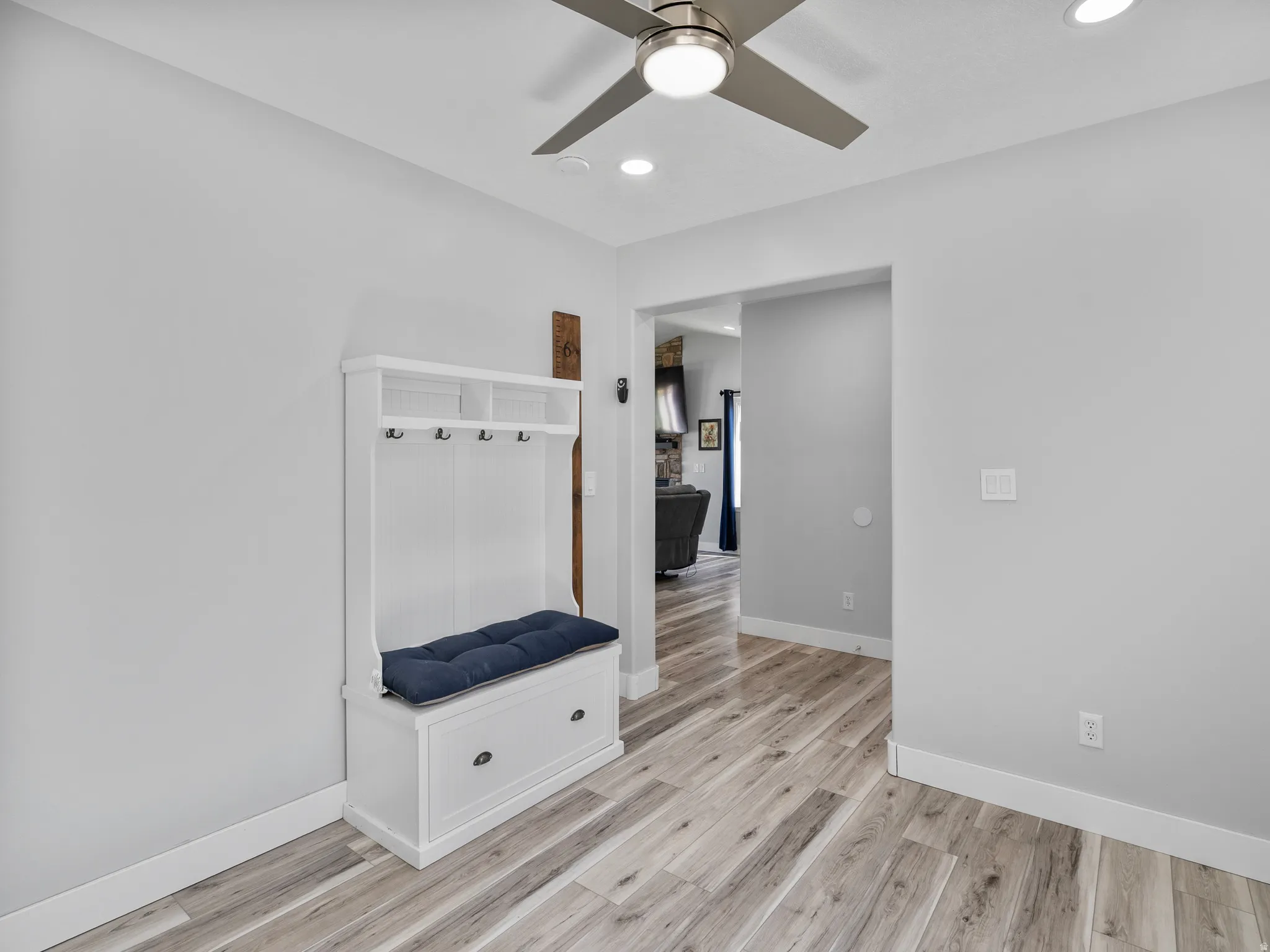 Mudroom featuring a ceiling fan, light wood-style floors, and recessed lighting
