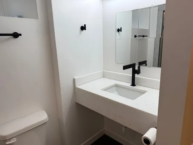 Half bath featuring toilet and vanity
