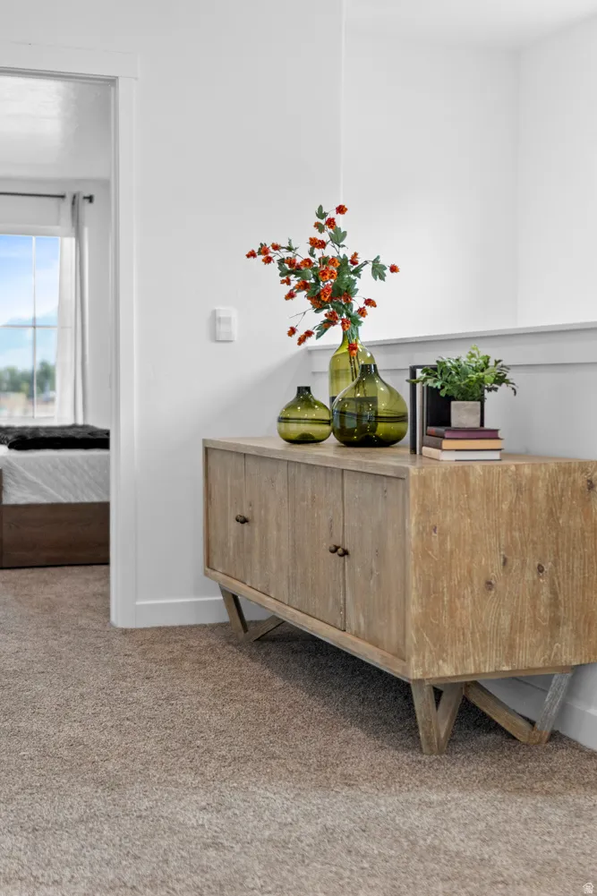 Detailed view of carpet floors and baseboards