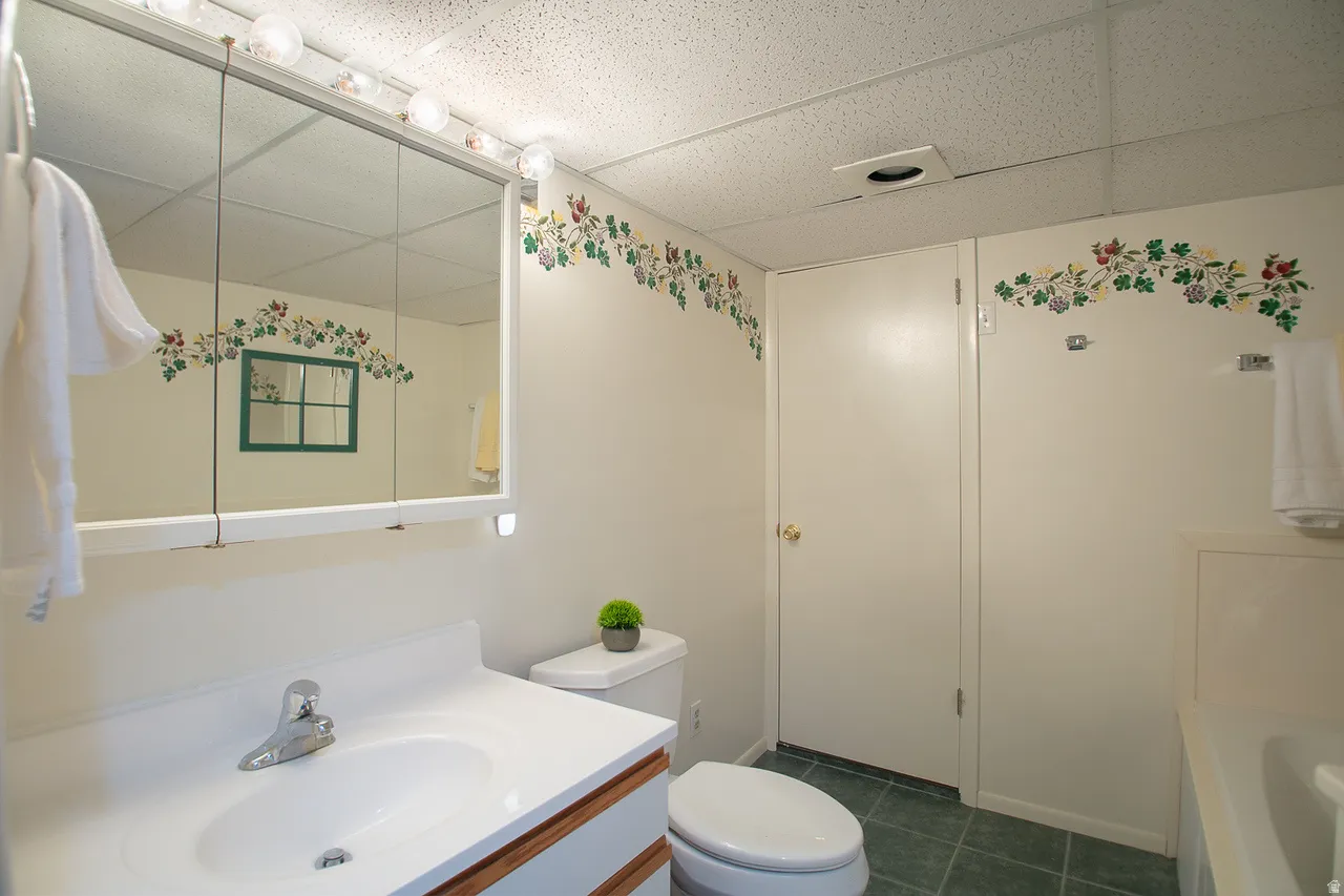 Full bath in basement featuring great lighting and very roomy