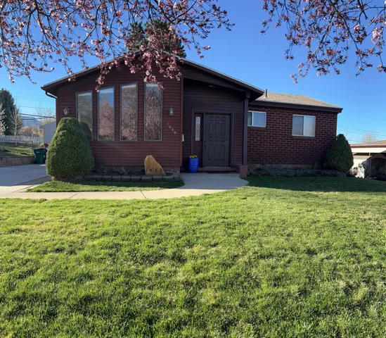 View of front of property with a front lawn