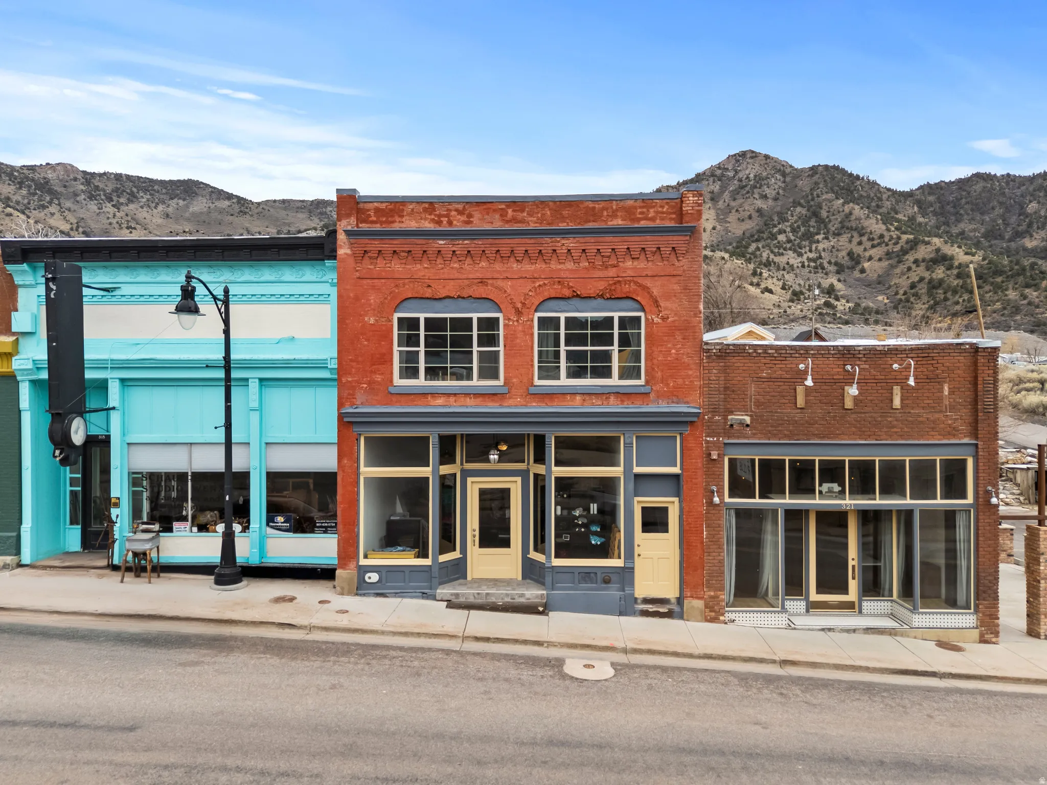 Store front entrance - north side of building. Facing Main Street. View of commercial property with a mountain view