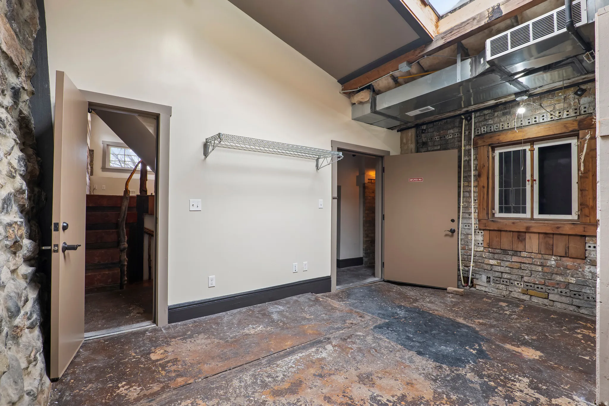 View of exterior entry with stucco siding