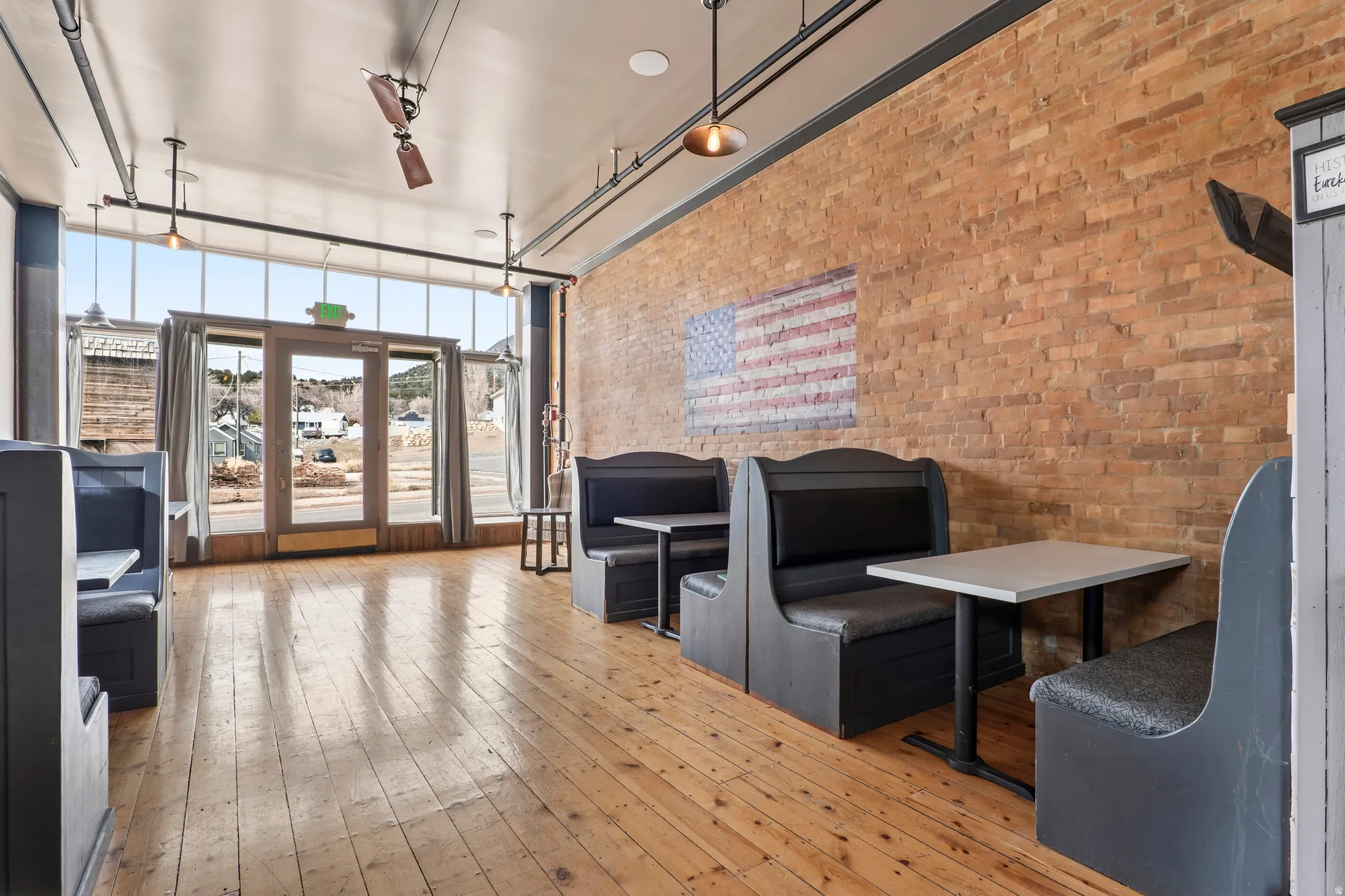 Lobby with brick wall and a high ceiling