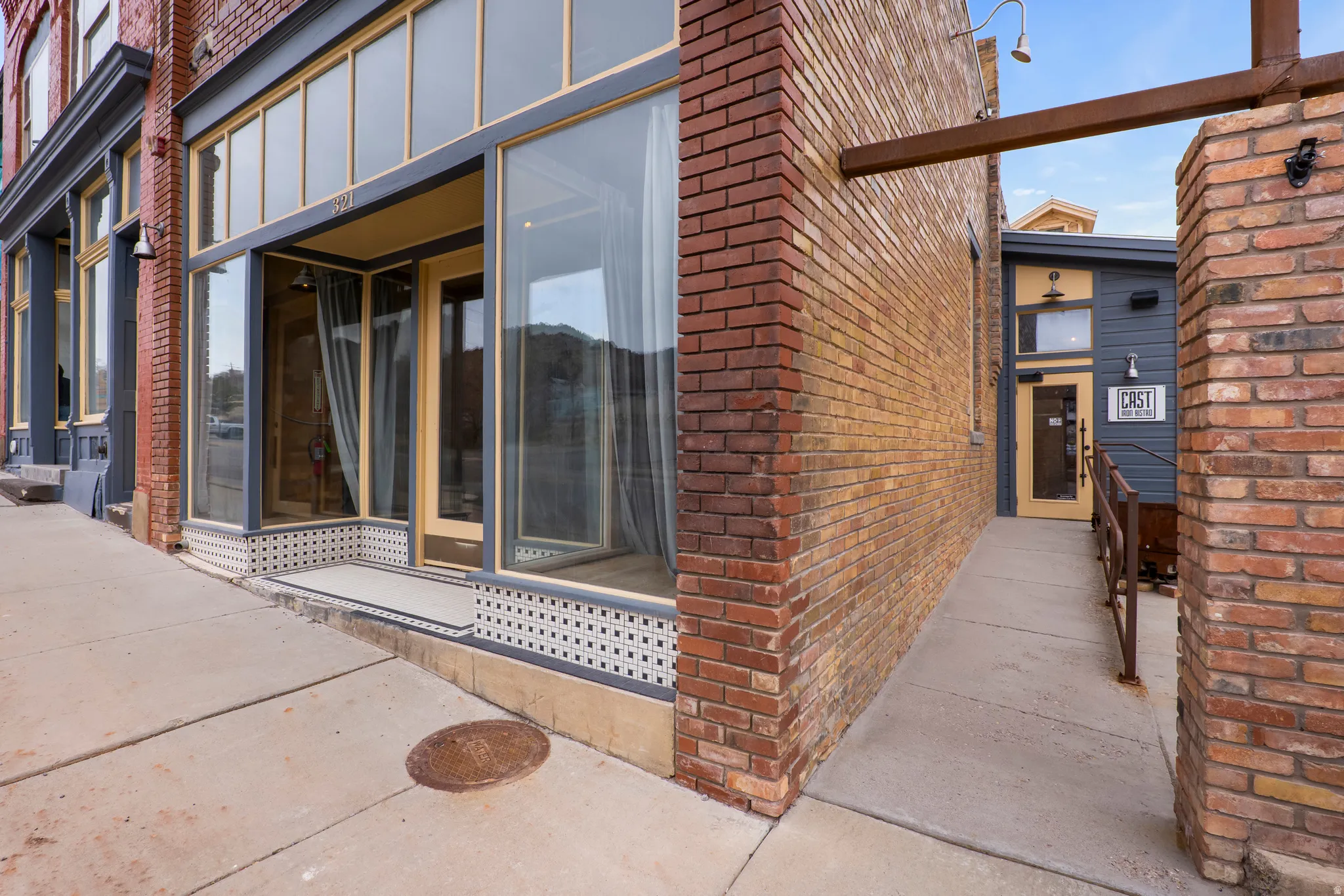 Doorway to property with brick siding