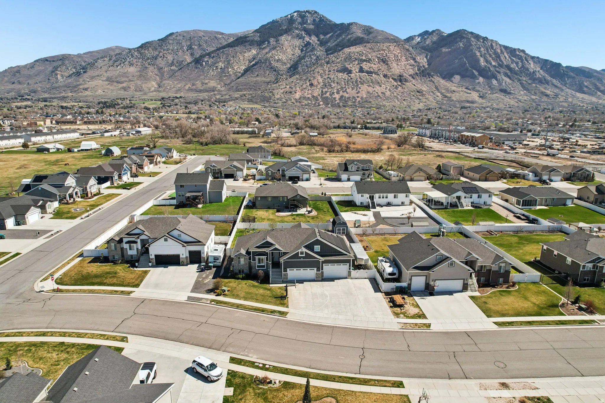 Aerial view of residential area featuring a mountain backdrop
