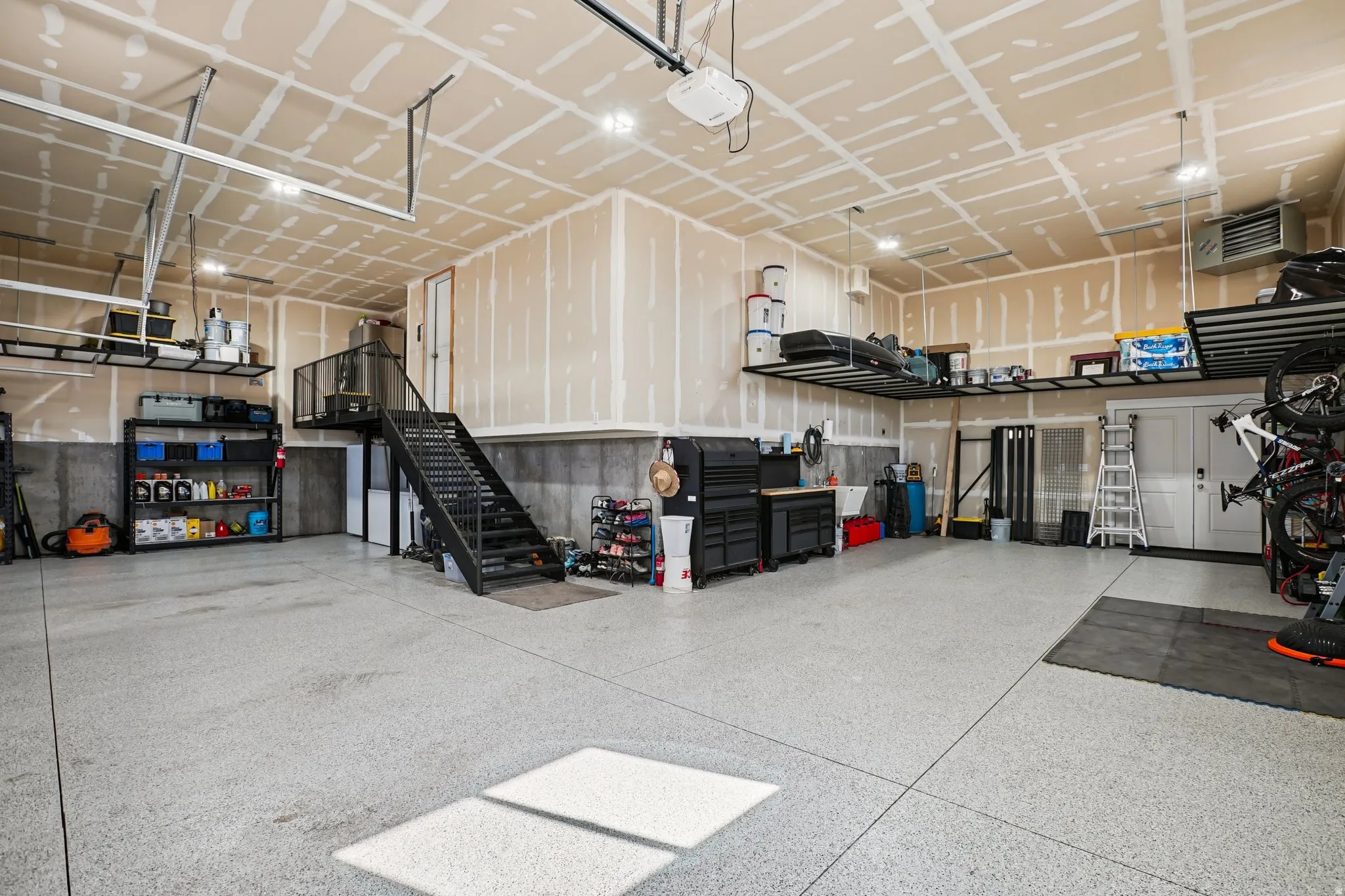 Garage with a heating unit and a garage door opener