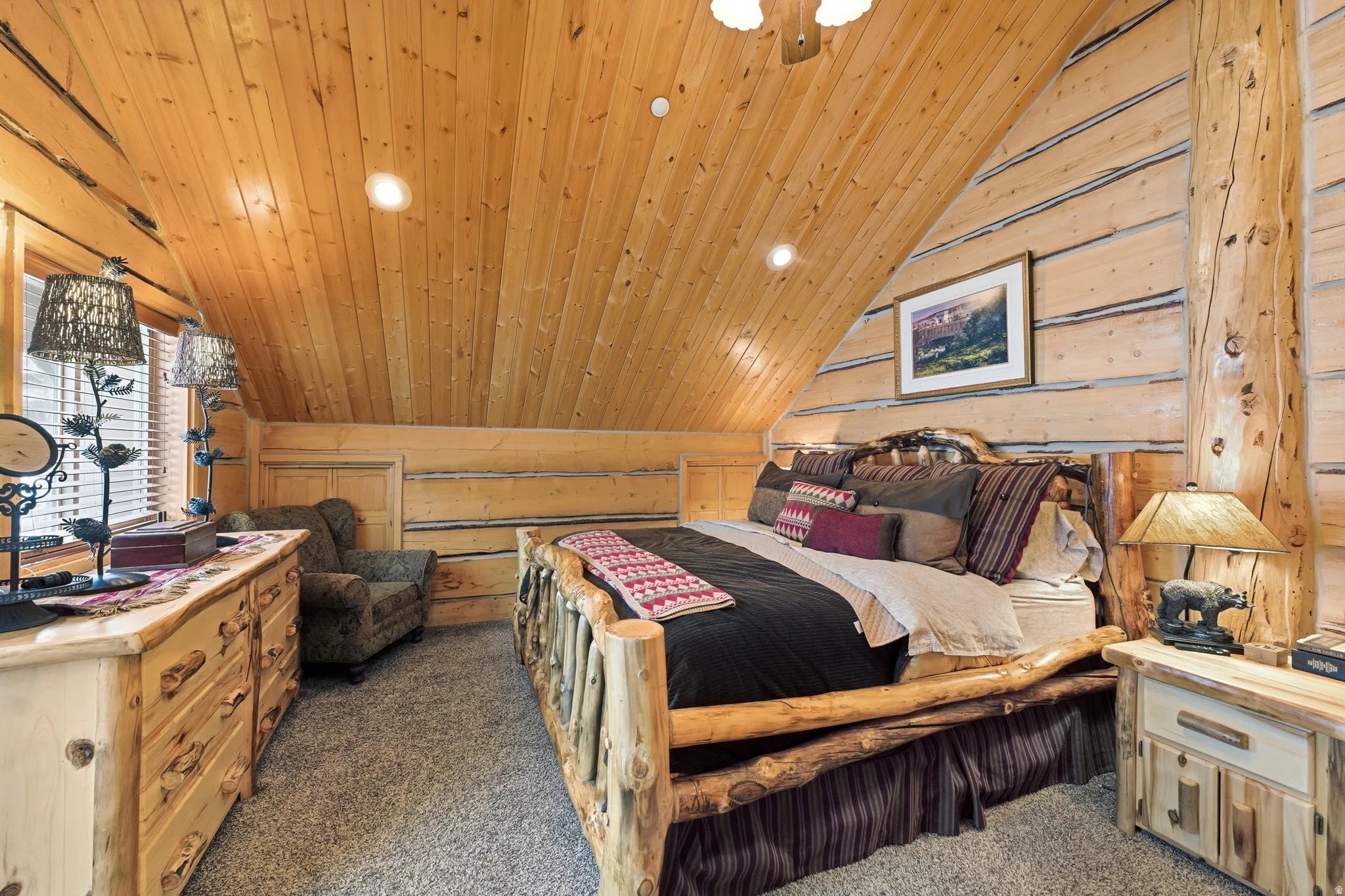 Bedroom with recessed lighting, wood walls, dark carpet, and a vaulted wooden ceiling