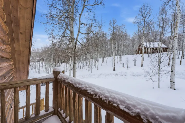 View of yard layered in snow