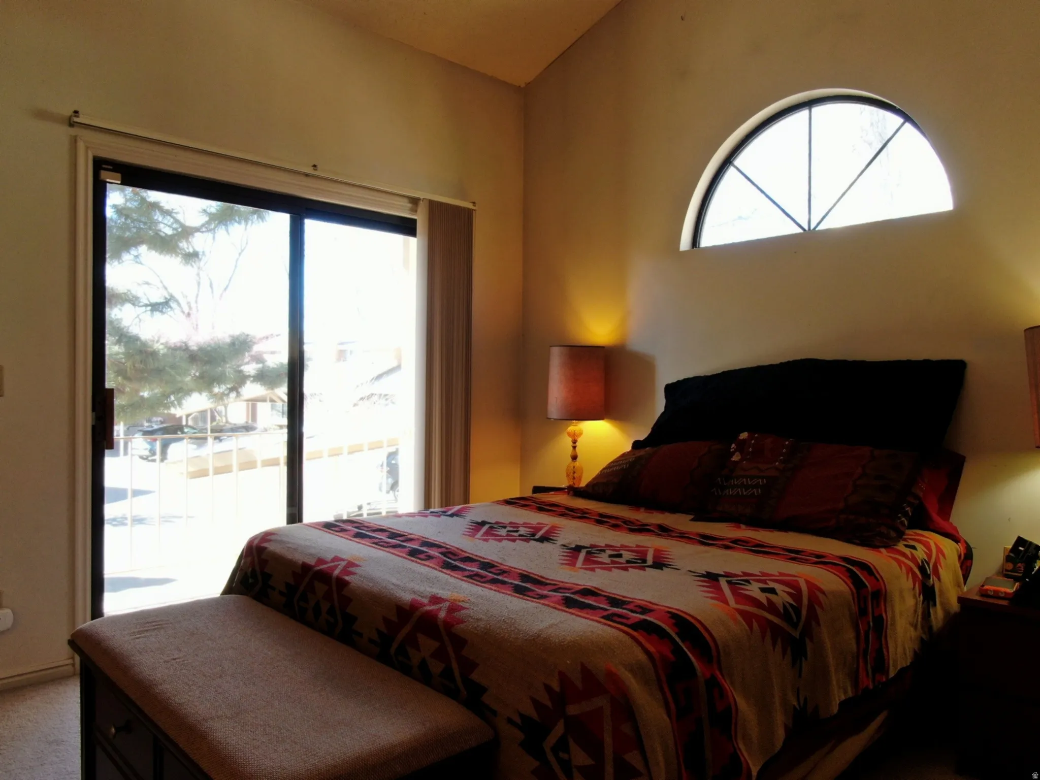 Carpeted bedroom featuring access to outside