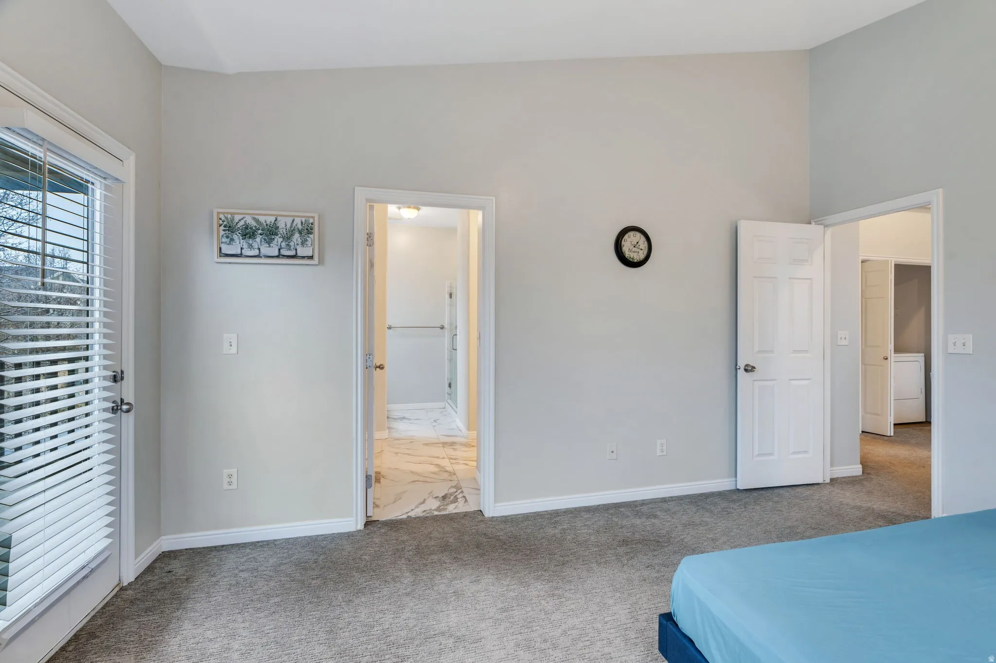 This primary suite offers an ensuite bath, walk-in closet & private balcony