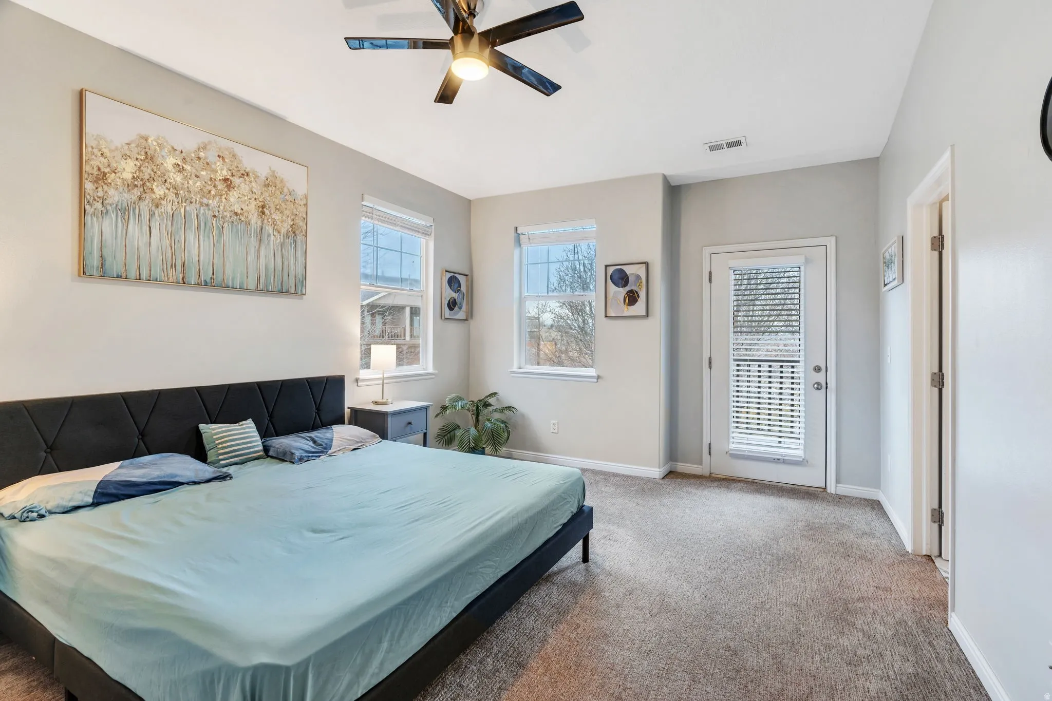 Peaceful, airy & inviting primary suite with a private balcony for a fresh air sense of living