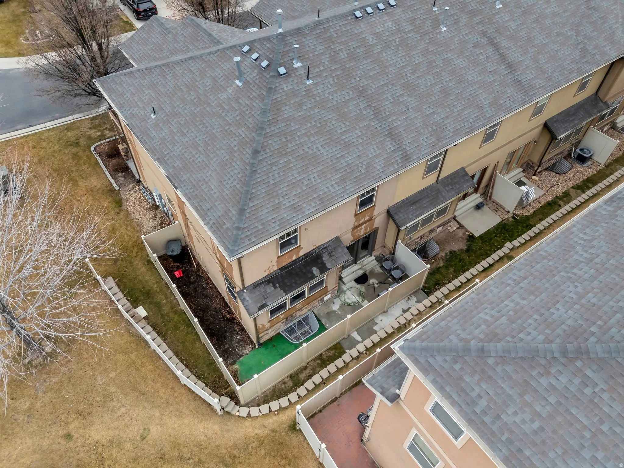 This end unit offers a larger private backyard.