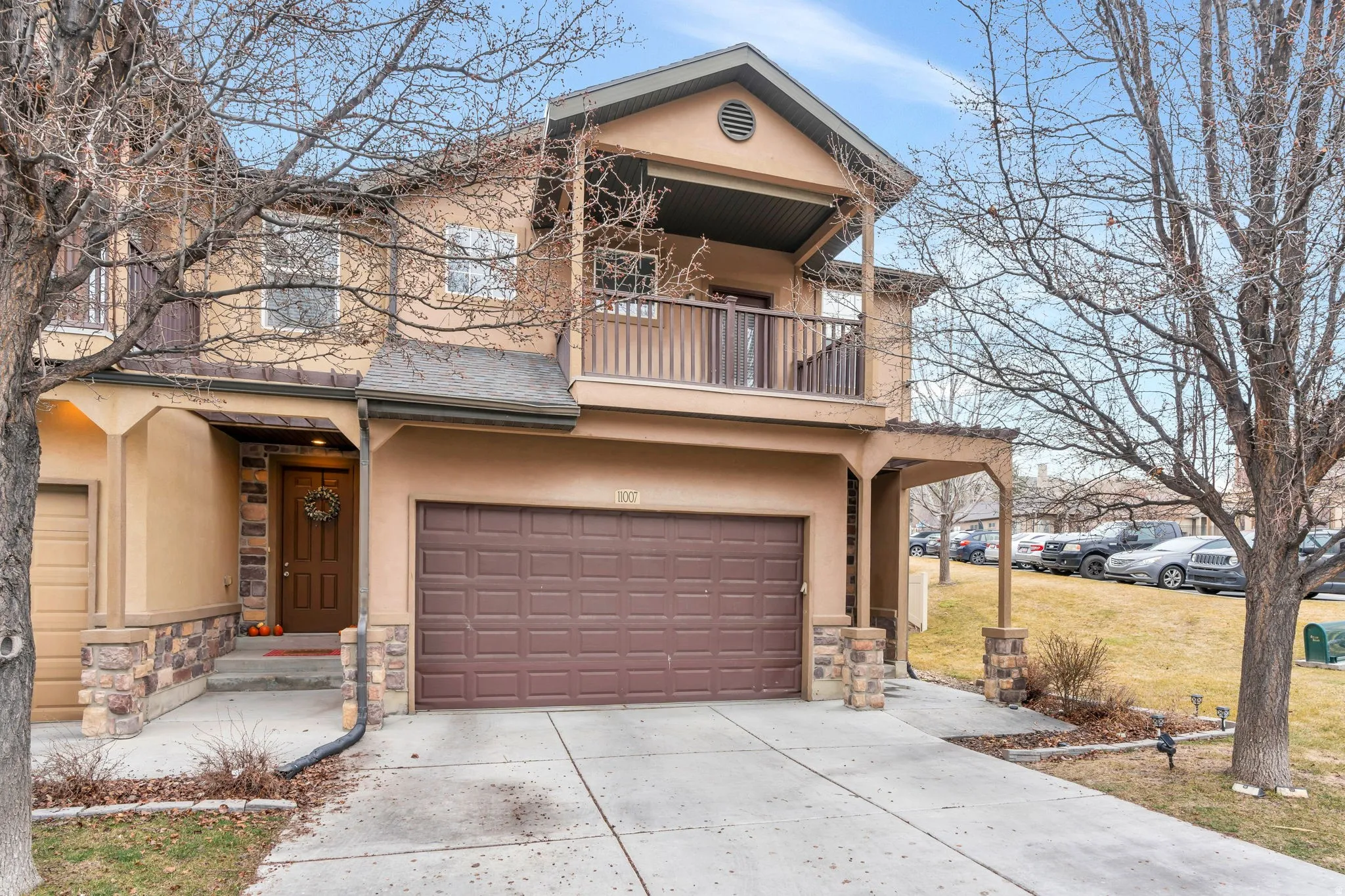 Parking for 2 cars in the garage and a large private balcony enhance the curb appeal