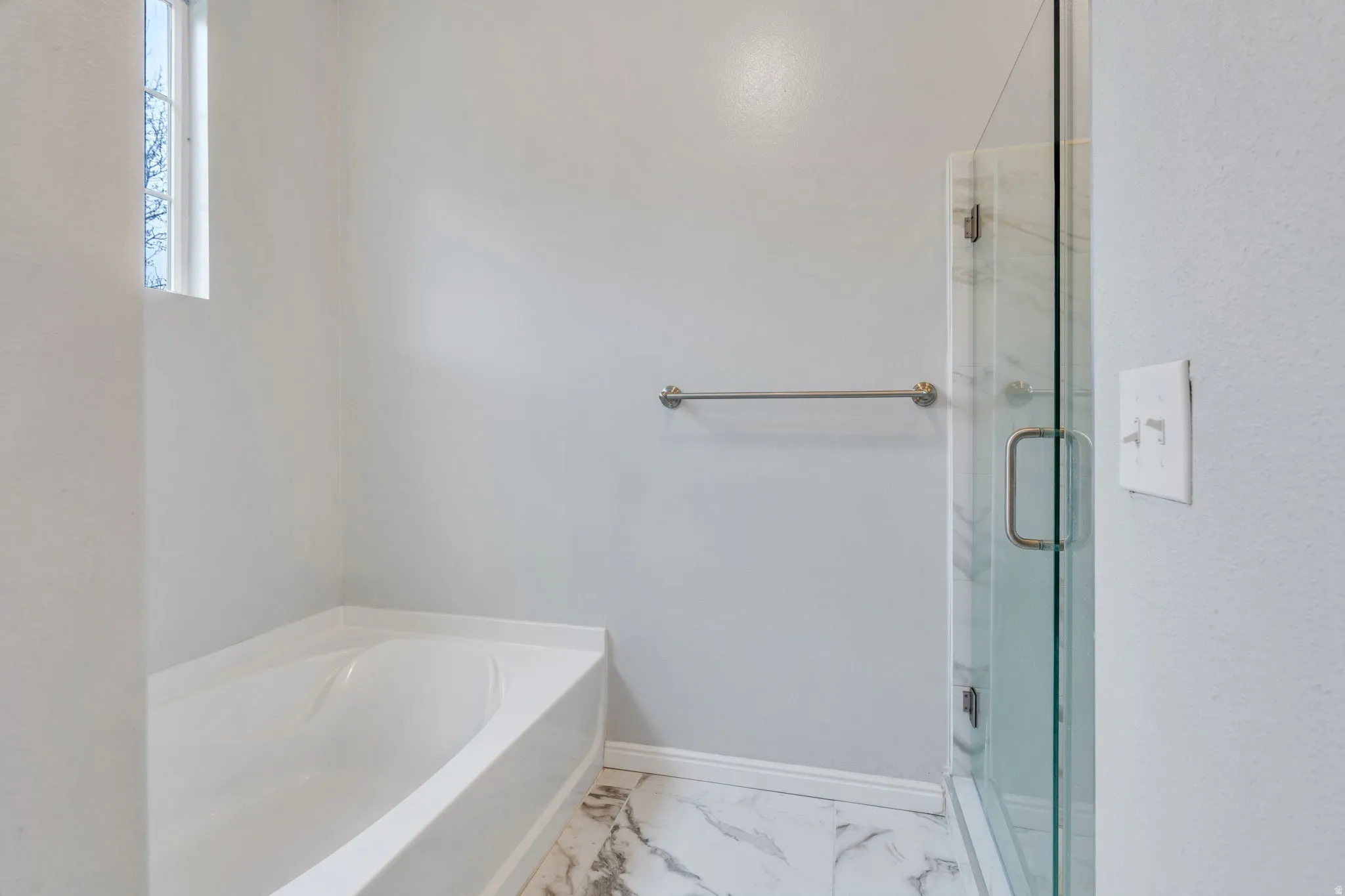 A large soaking tub & euro shower give this bathroom a spa-like feel