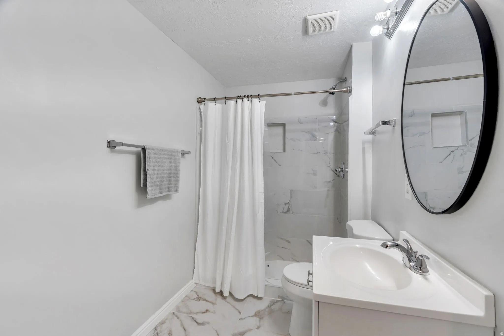 Large bright walk in shower with modern finished