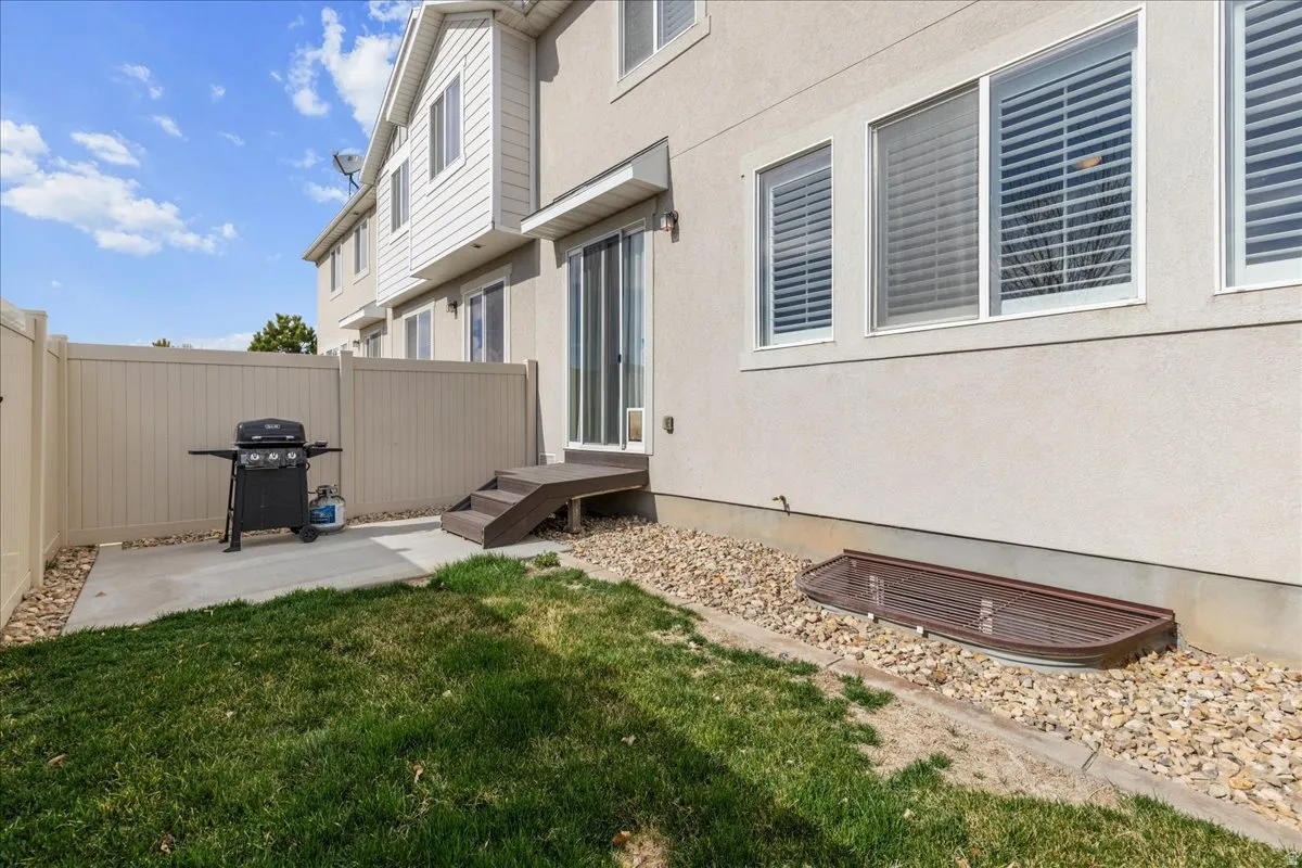Fenced yard featuring a patio area