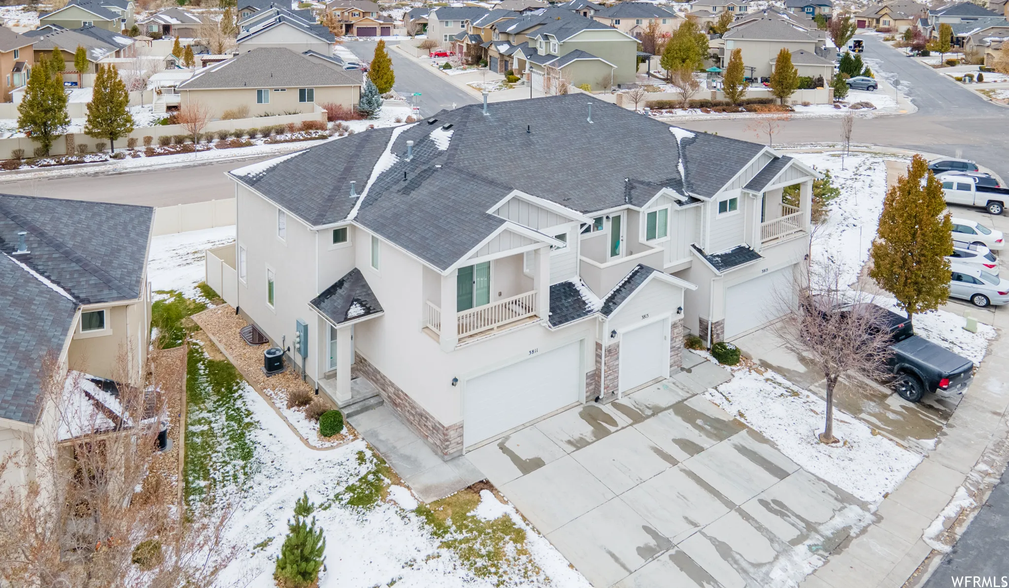 Snowy aerial view featuring a residential view