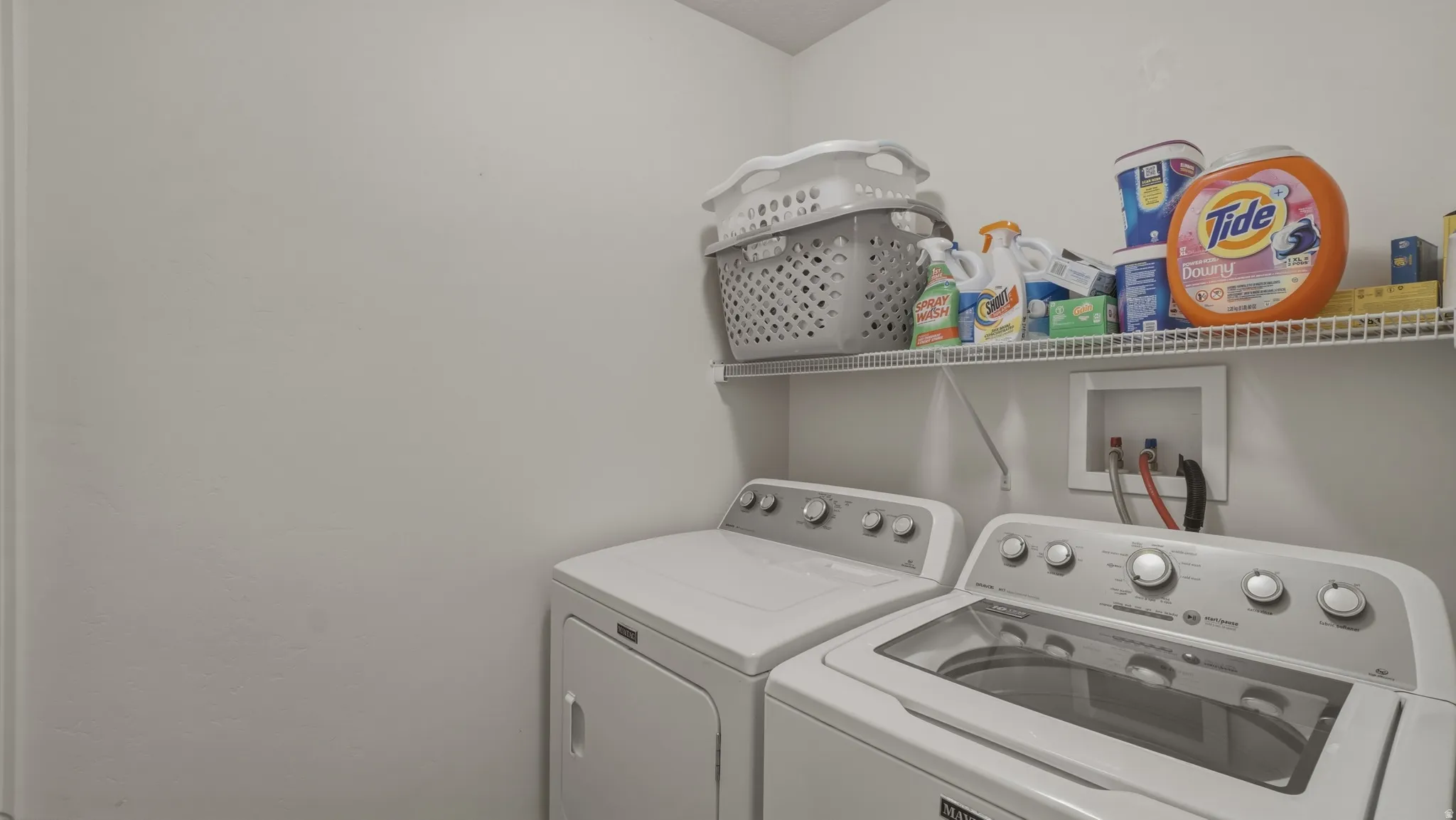 Laundry area with washing machine and clothes dryer