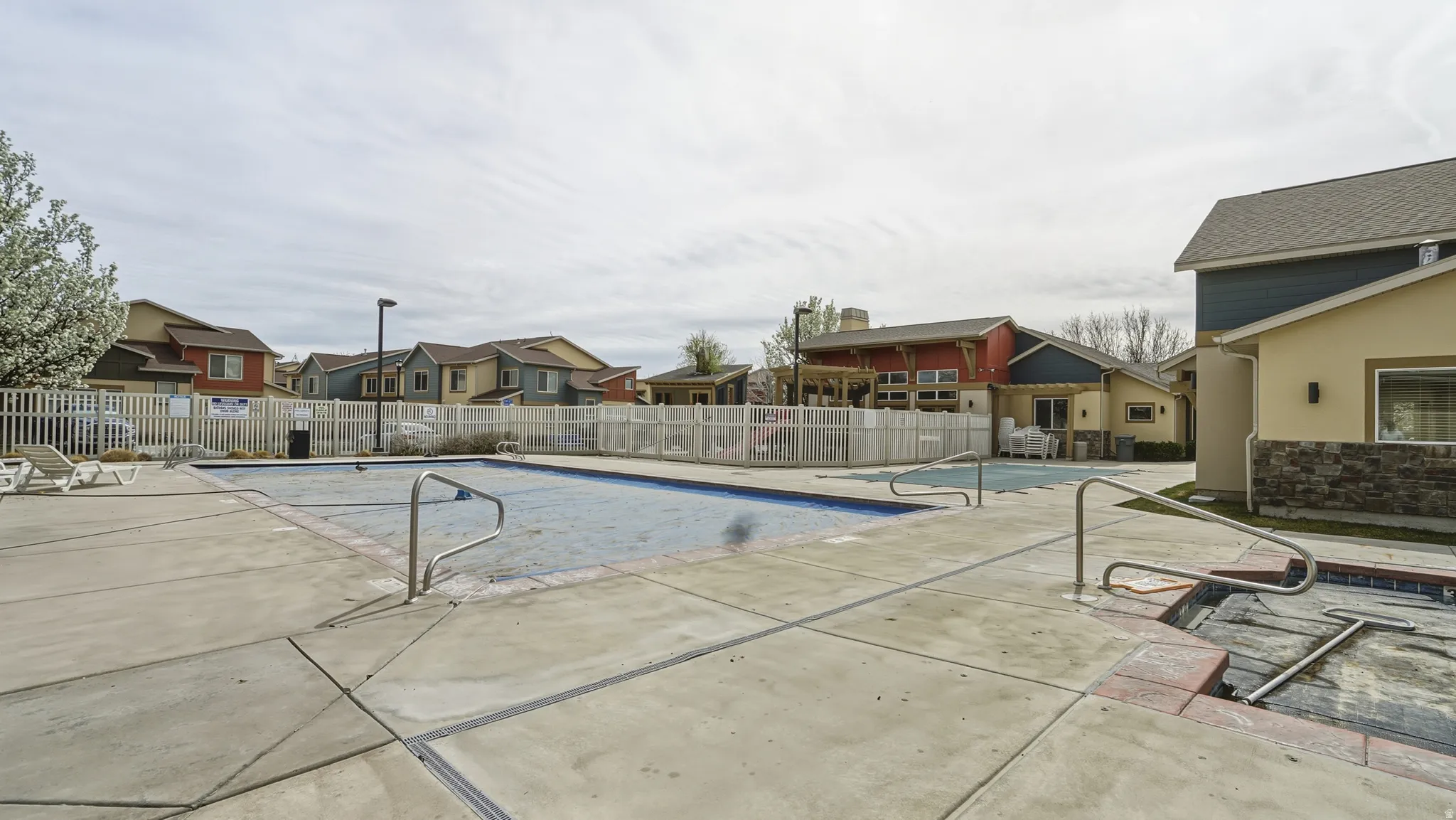 Community pool with a residential view
