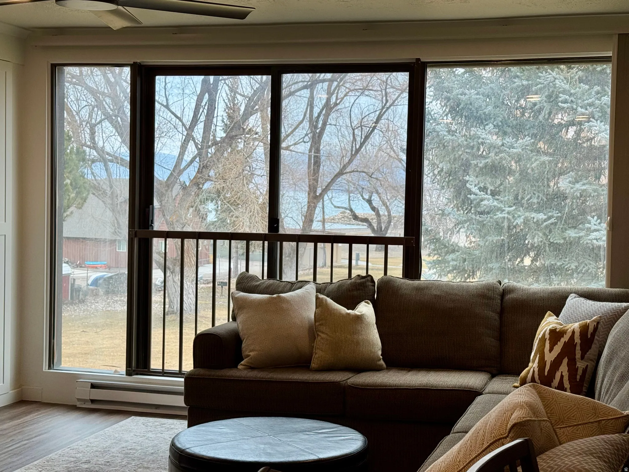 Sunroom featuring baseboard heating and plenty of natural light