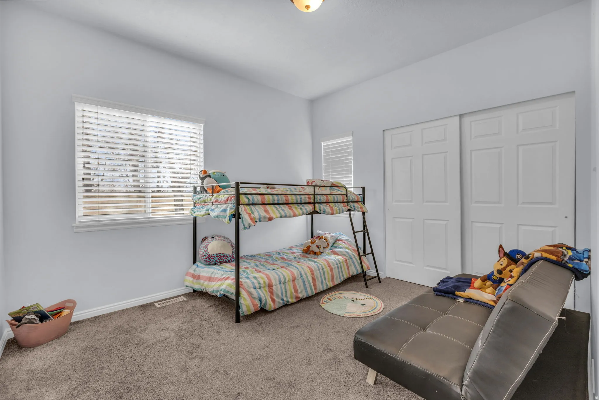 Bedroom featuring carpet floors and a closet