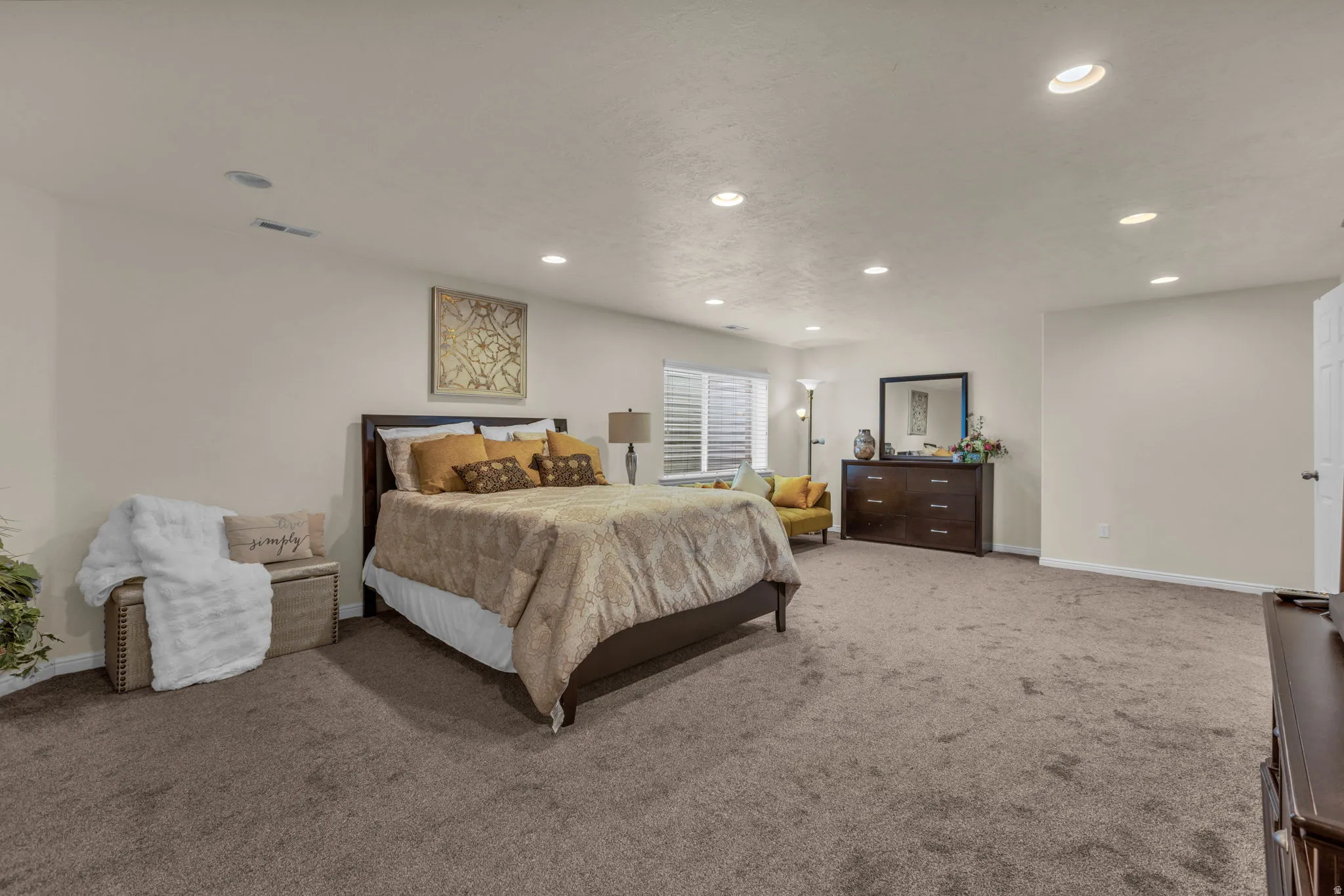 Carpeted bedroom featuring baseboards and recessed lighting