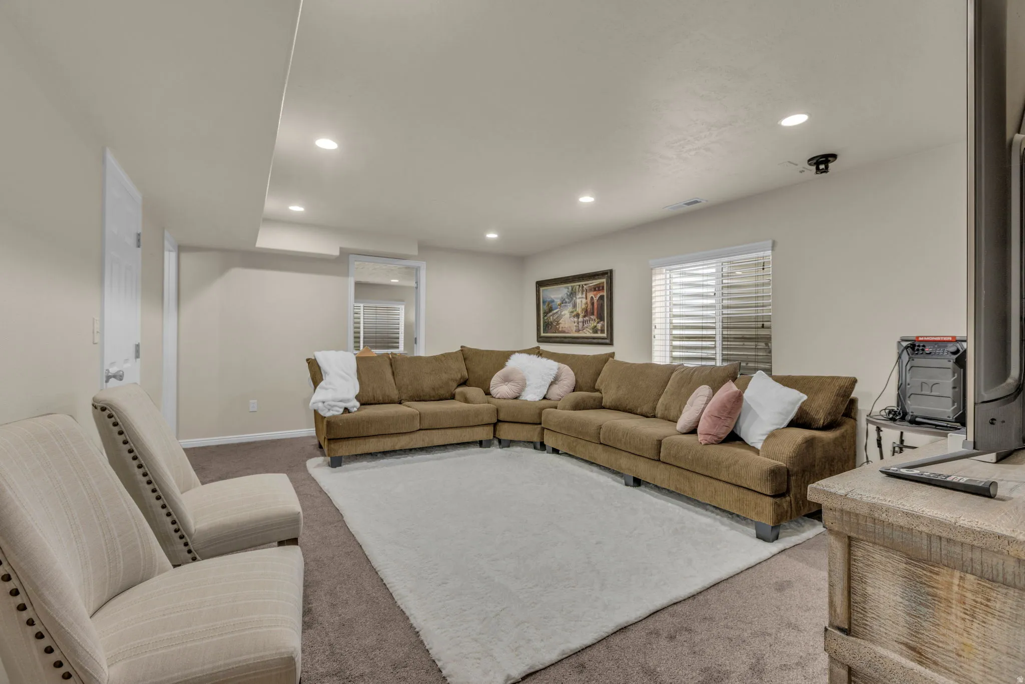 Living room with recessed lighting and carpet floors