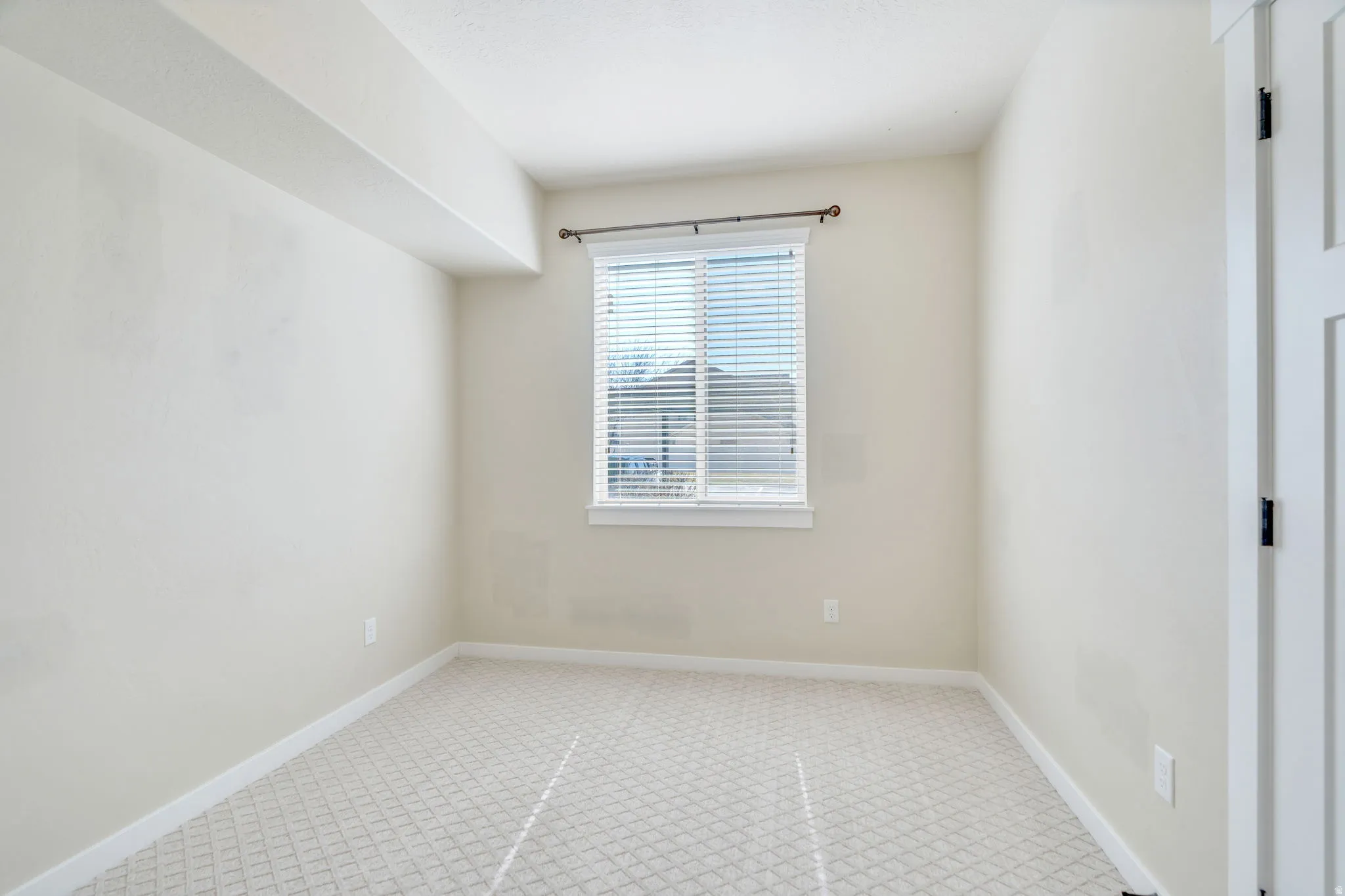 Spare room with light carpet