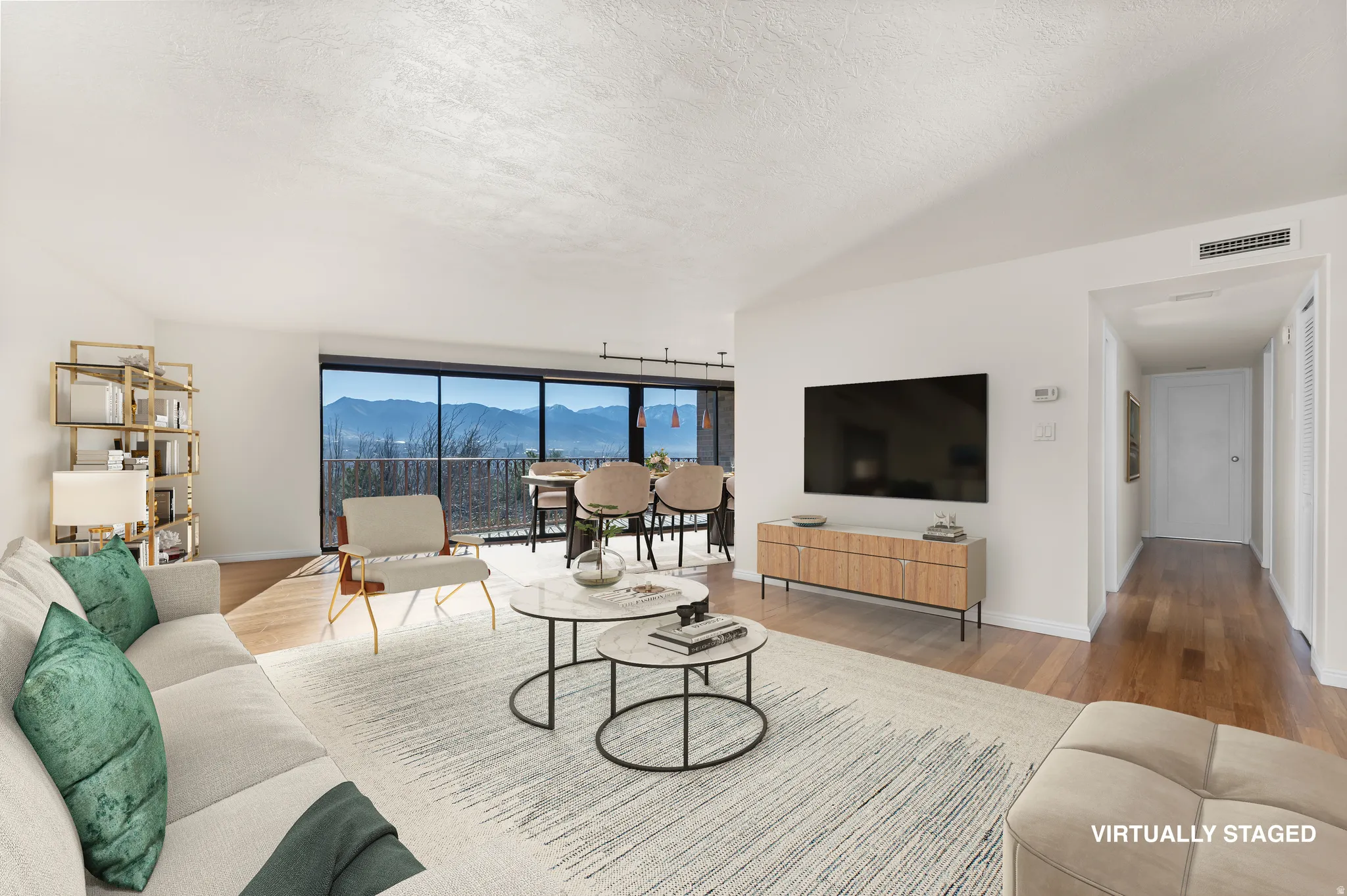 Living room featuring wood finished floors and a textured ceiling